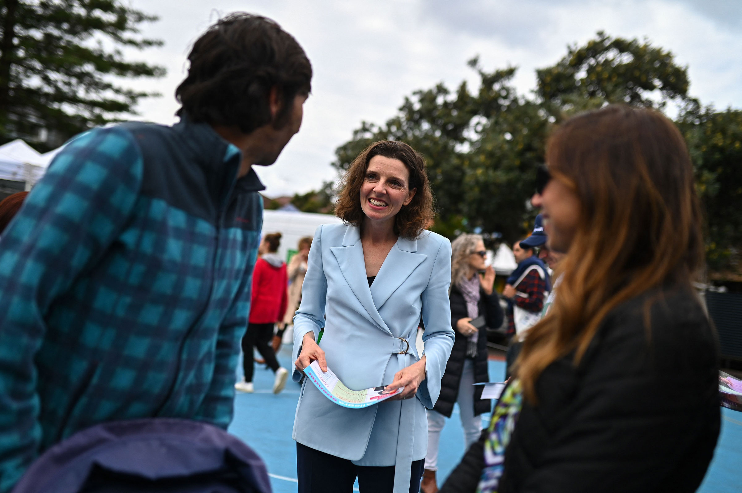 Federal independent candidate for Wentworth Allegra Spender speaks to voters during Australia's general election at a polling station at Bondi Beach in Sydney on May 21, 2022. (Steven Saphore—AFP/Getty Images)