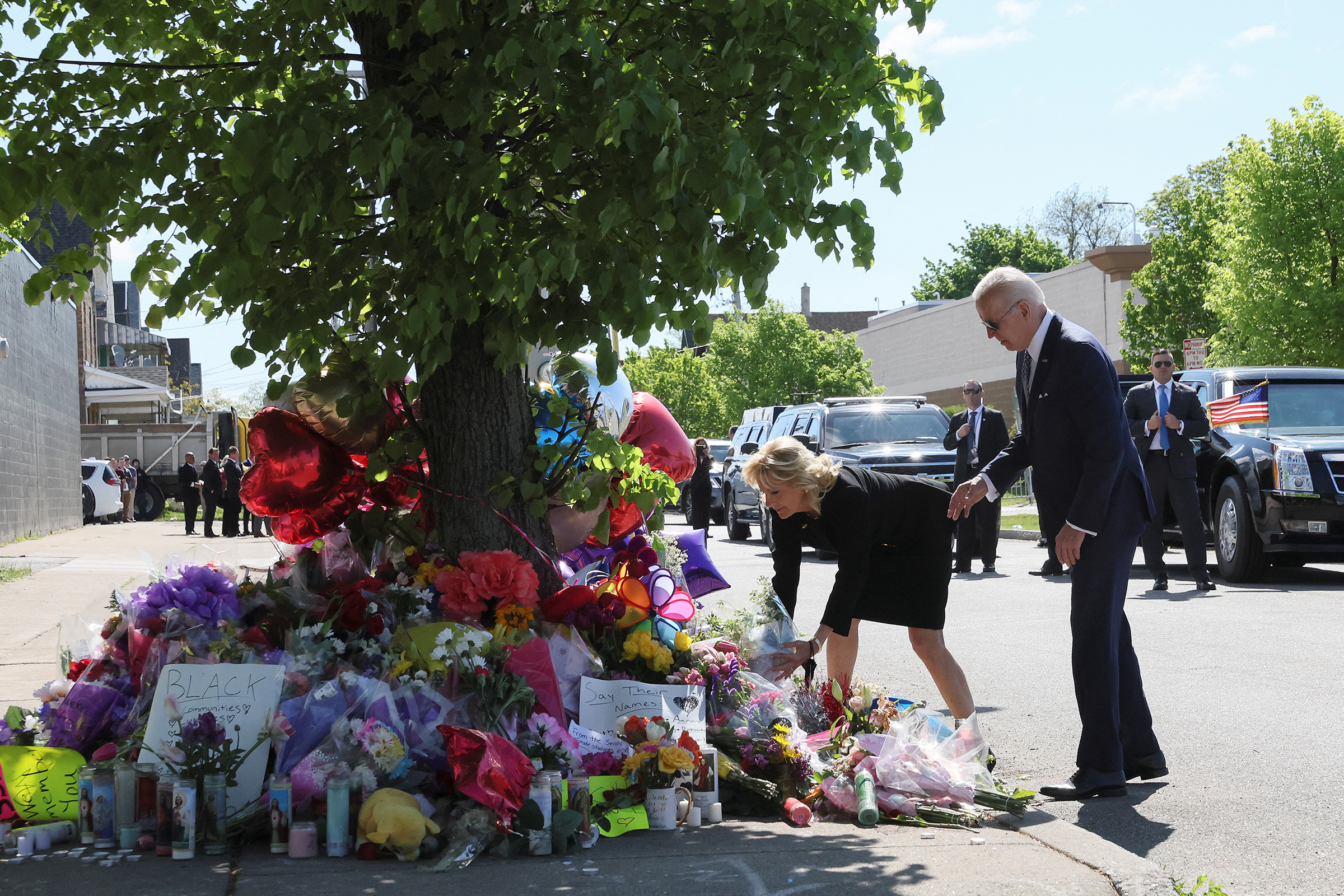 U.S. President Joe Biden and first lady Jill Biden pay their respects to the 10 people killed in a mass shooting by a gunman authorities say was motivated by racism, at the Tops Friendly Markets memorial site in Buffalo, N.Y. on May 17. (Leah Millis—Reuters)