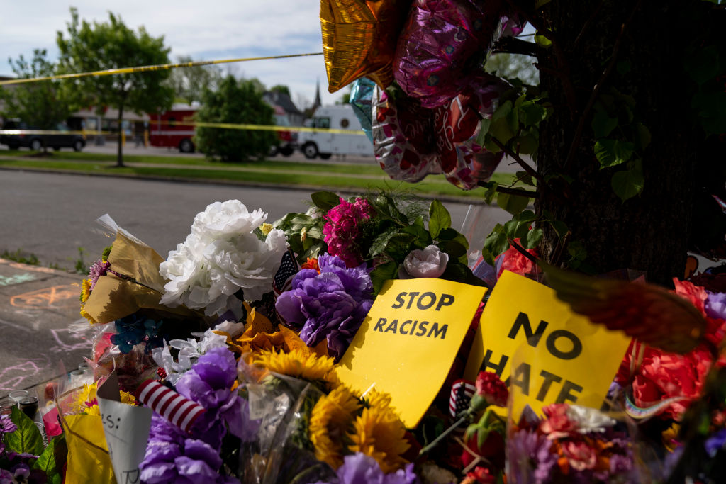 A memorial across the street from Tops Friendly Market at Jefferson Avenue and Riley Street on May 18, 2022, in Buffalo, N.Y. The Supermarket was the site of a fatal shooting of 10 people at a grocery store in a historically Black neighborhood of Buffalo. (Kent Nishimura—Los Angeles Times via Getty Images)