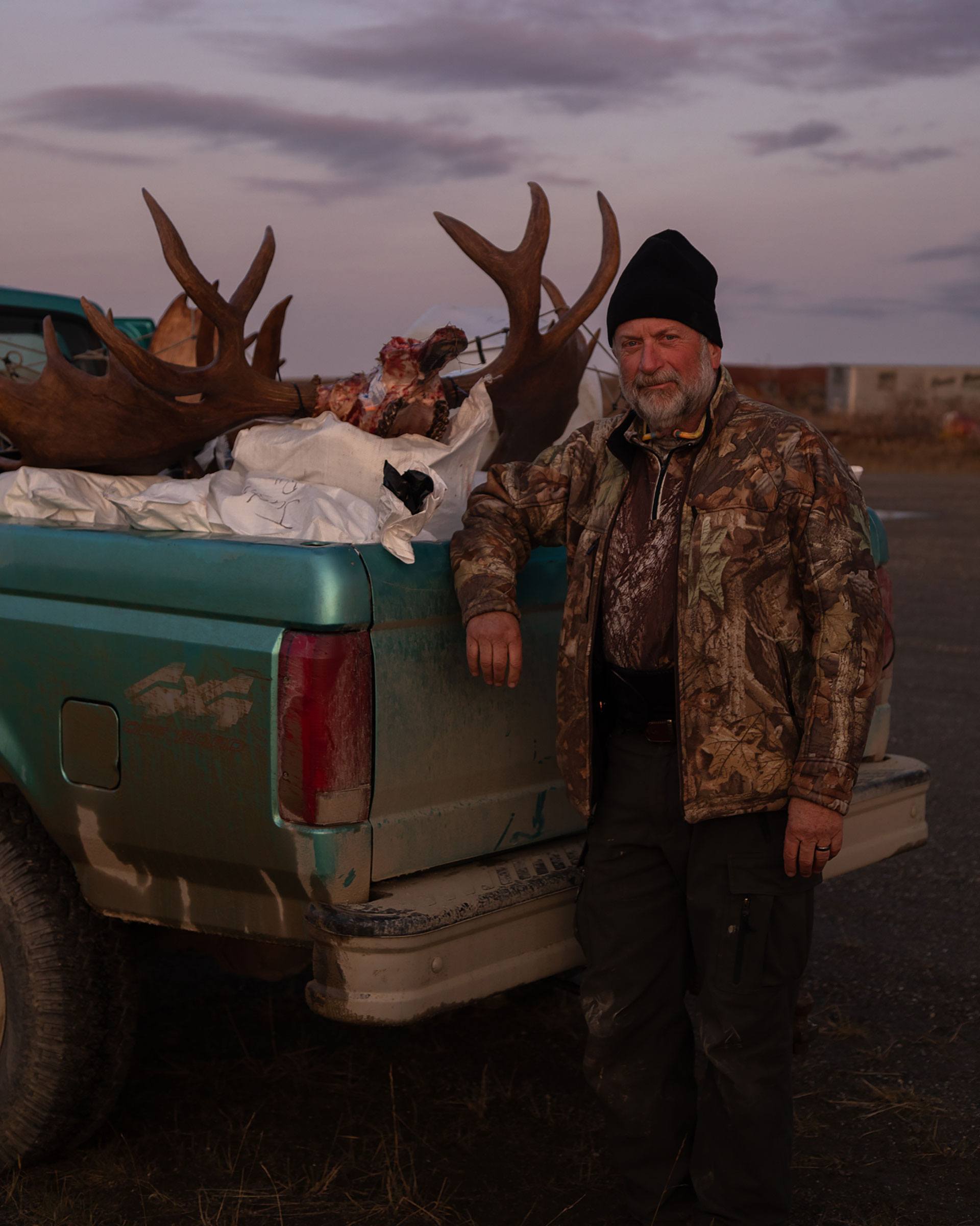 Nome resident Jeff Russell loads a pickup truck with moose meat after a successful hunt by bush plane. (Acacia Johnson for TIME)