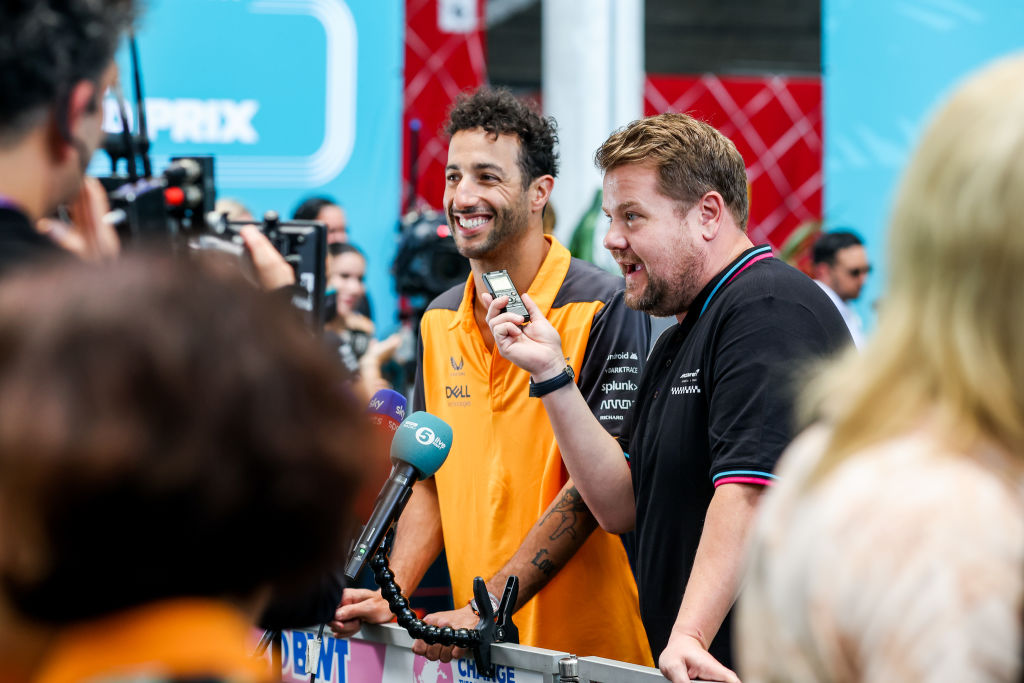 Daniel Ricciardo of Australia and McLaren playing around with James Corden of Great Britain during practice ahead of the F1 Grand Prix of Miami at the Miami International Autodrome on May 06, 2022 in Miami, (Peter J Fox—Getty Images)