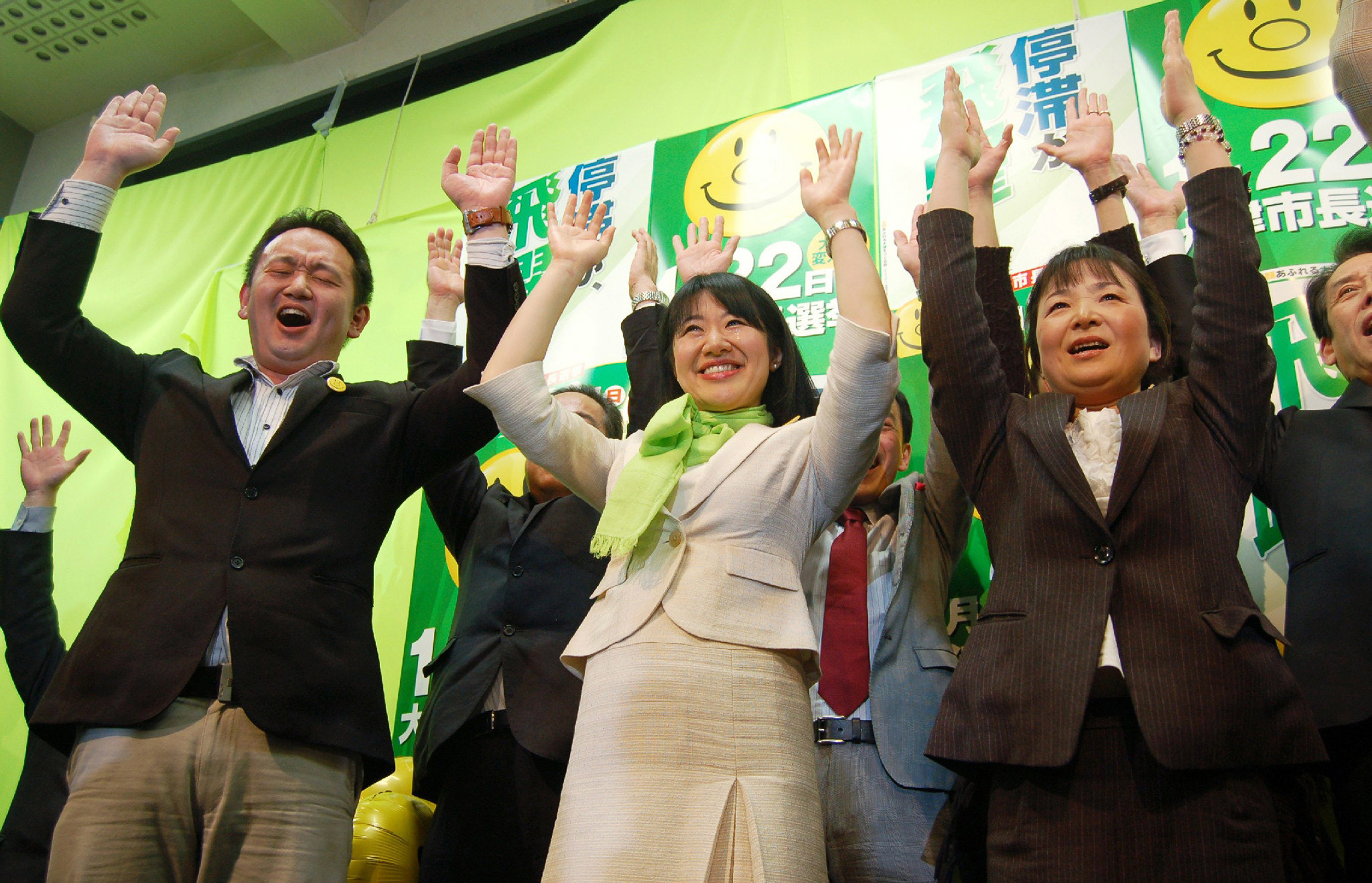 Koshi, center, celebrates her election in 2012 as the youngest woman to serve as a mayor in Japan (STR/JIJI PRESS/AFP/Getty Images)