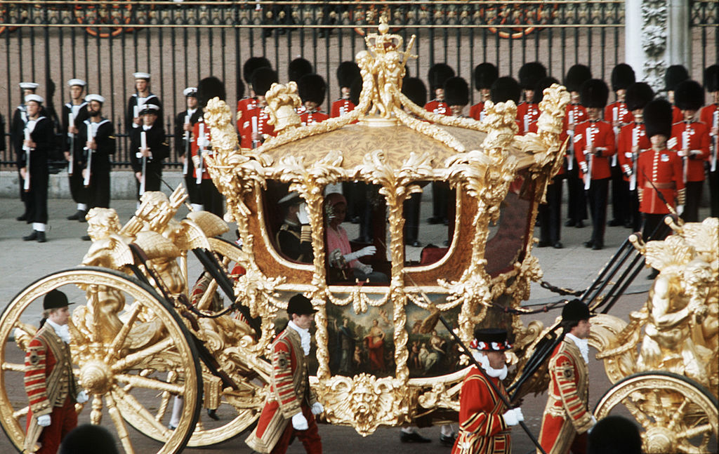 Queen Elizabeth II with Prince Philip, the Duke of Edinburgh in the Gold State Coach during the Queen's Silver Jubilee in London, June 7 1977. (Anwar Hussein—Getty Images)