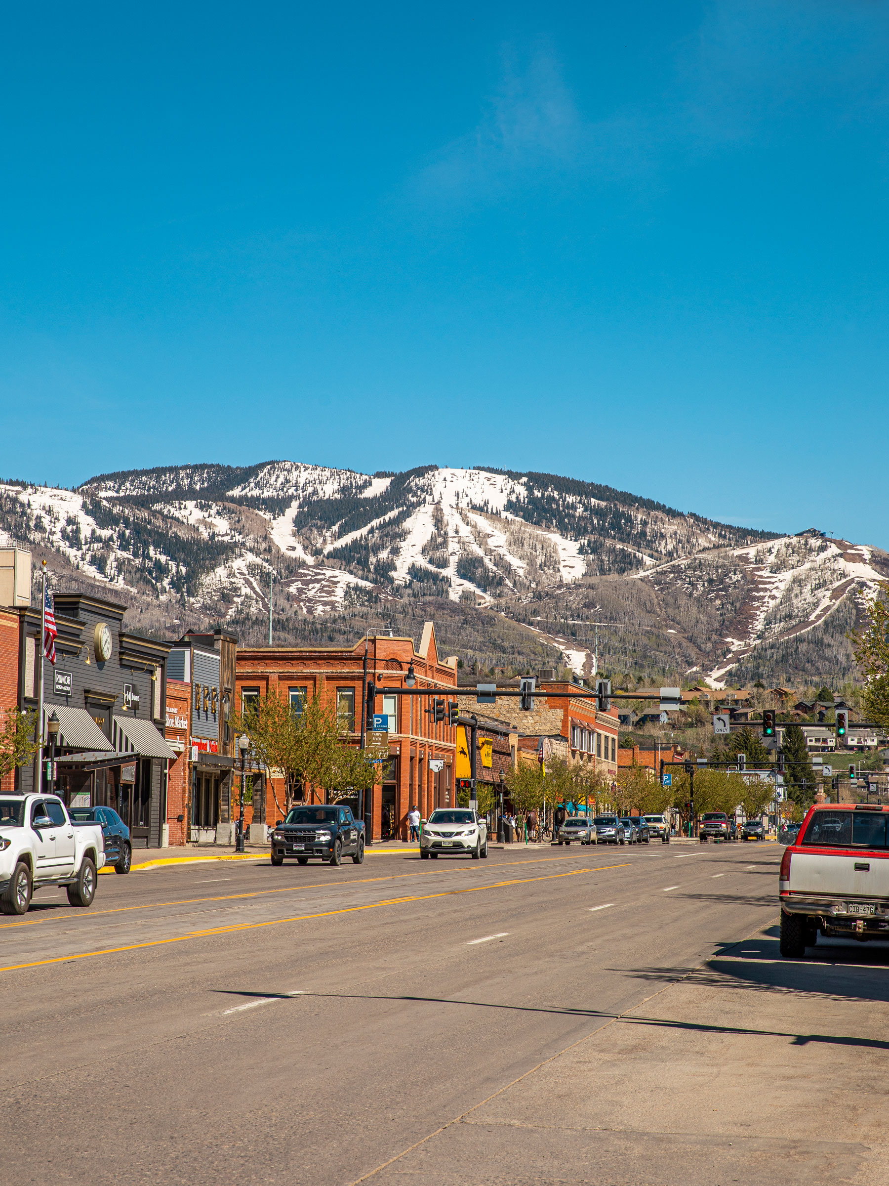 Traffic passes through the downtown area of Steamboat Springs, Colorado