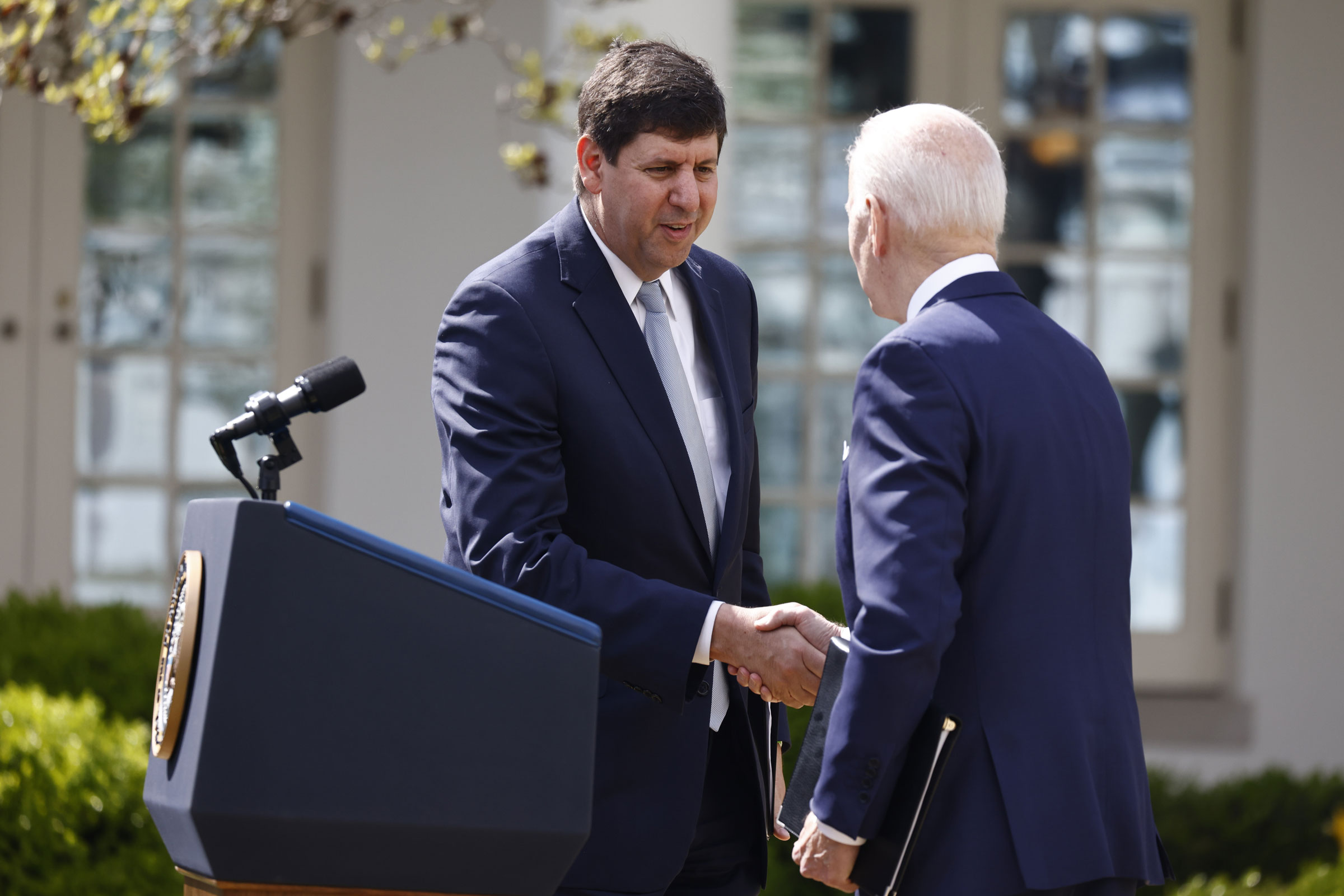 Steve Dettelbach, nominee for director of the Bureau of Alcohol, Tobacco, Firearms and Explosives (ATF), left, shakes hands with U.S. President Joe Biden before speaking in the Rose Garden of the White House in Washington, D.C., U.S., on Monday, April 11, 2022. (Ting Shen—Bloomberg/Getty Images)