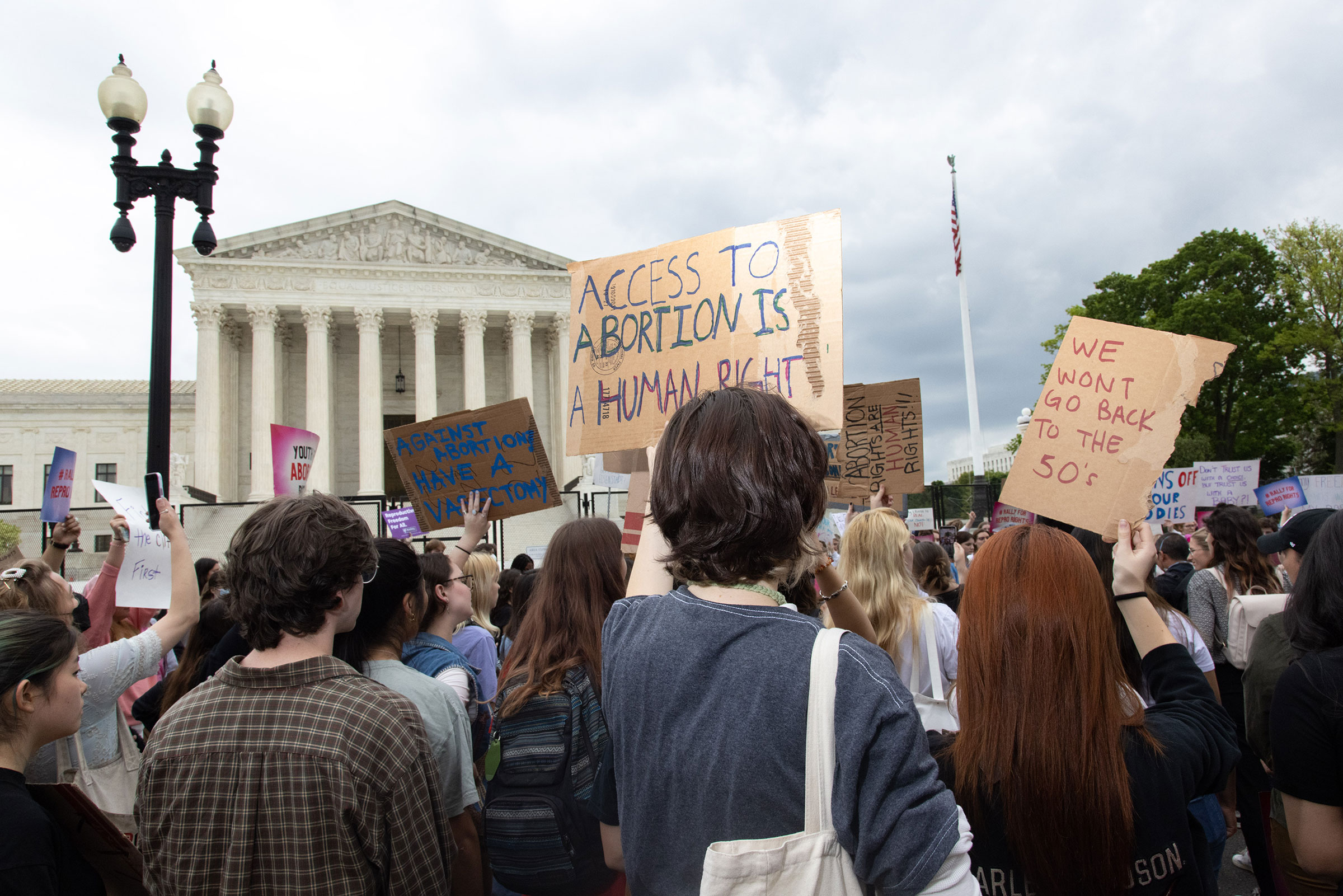 Youth pro-abortion rights demonstrators rally outside Supreme Court