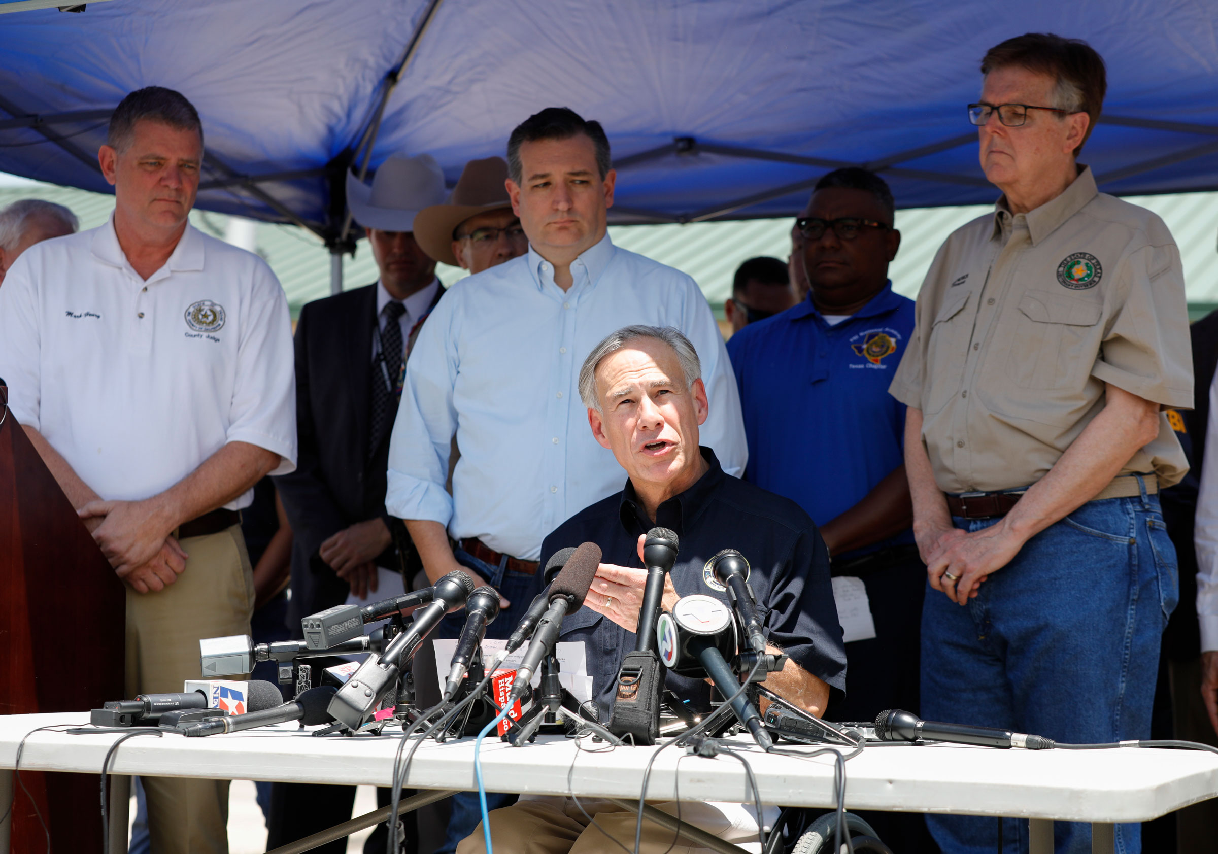 Galveston County Judge Mark Henry, Sen.Ted Cruz, Texas Gov. Greg Abbott and Texas Lt. Gov. Dan Patrick speak to the media during a press conference about the shooting incident at Santa Fe High School May 18, 2018 in Santa Fe, Texas. (Bob Levey—Getty Images)