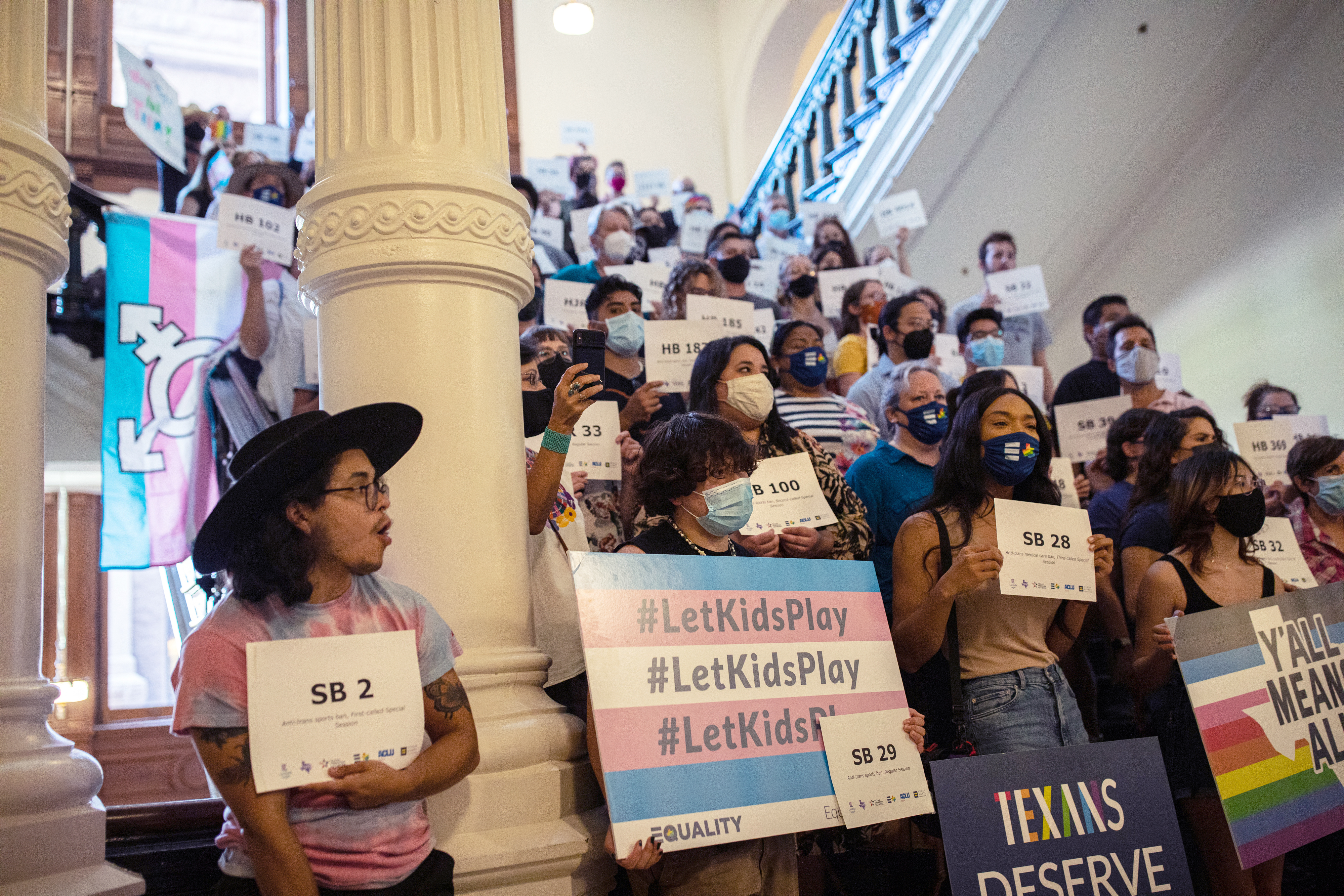 LGBTQ rights supporters gather at the Texas State Capitol on Sept. 20, 2021, to protest Republican-led efforts to ban trans student athletes from playing on the sports team aligned with their gender identity. (Tamir Kalifa—Getty Images)
