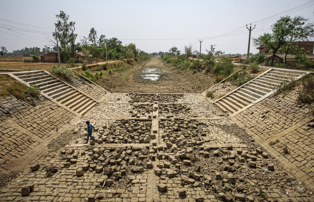 A dried canal on May 21, 2022 in the village of Badokhar, Uttar Pradesh, India, during a severe heatwave which has caused drought conditions in vast swathes of India's agricultural heartlands. (Ritesh Shukla—Getty Images)