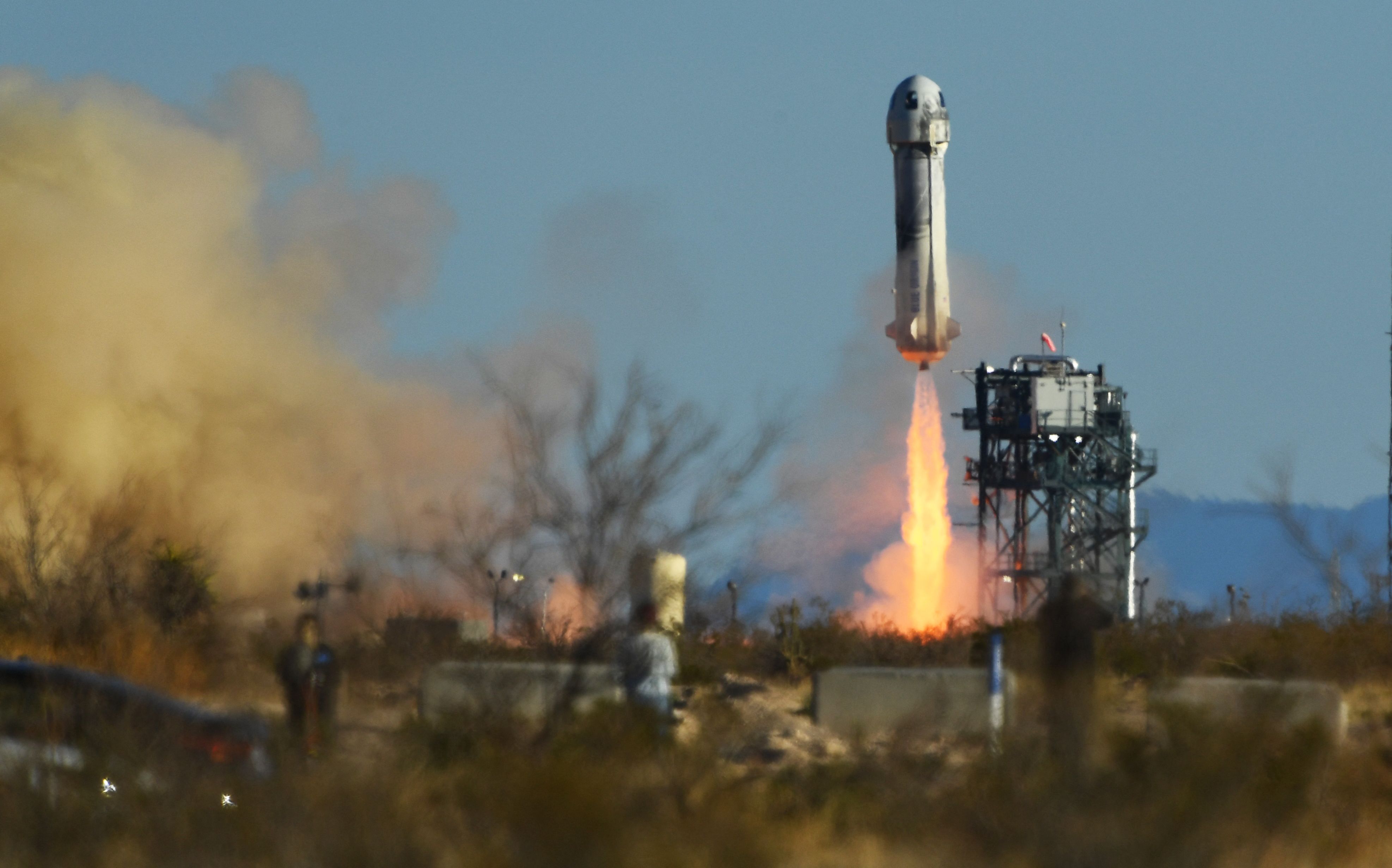 A crewed Blue Origin New Shepard rocket launches from West Texas north of Van Horn on March 31, 2022. (Patrick T. Fallon—AFP/Getty Images)