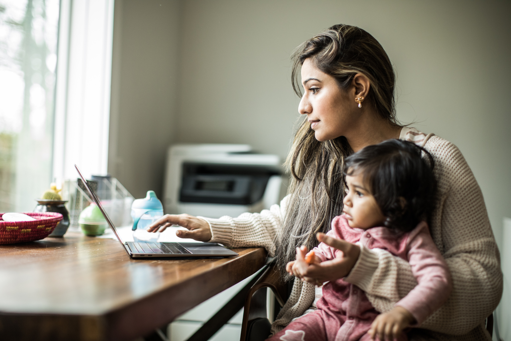 Many parents who could work from home adapted during the pandemic to juggling parenting and work (Getty Images)