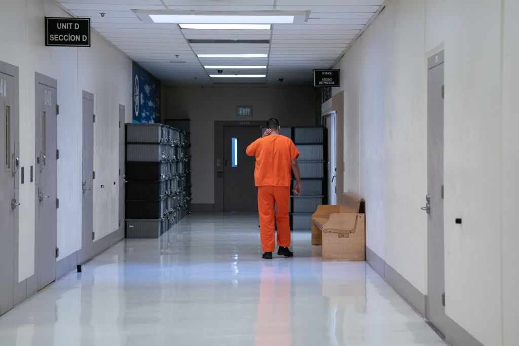 A detainee walks through the Northwest ICE Processing Center (NWIPC), formerly known as the Northwest Detention Center, during a press tour on Monday, Dec. 16, 2019, in Tacoma, Wash. (Jovelle Tamayo/For The Washington Post—Getty Images)