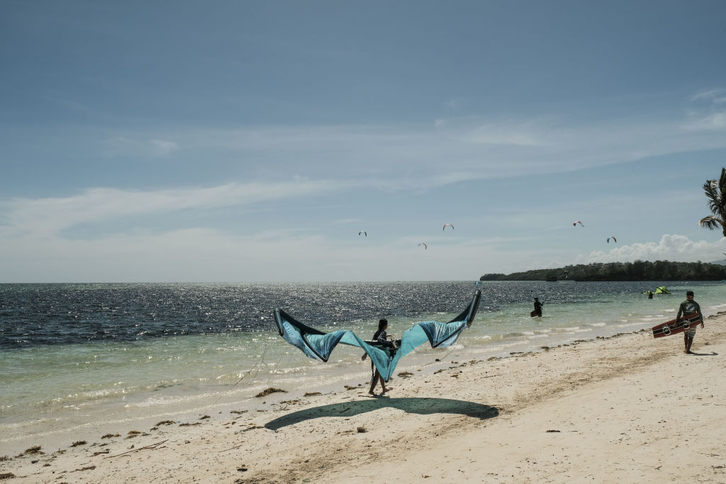 Kiteboarding enthusiasts in Bulabog town in Boracay, Aklan, the Philippines, on Wednesday, March 23, 2022. (Veejay Villafranca/Bloomberg via Getty Images)