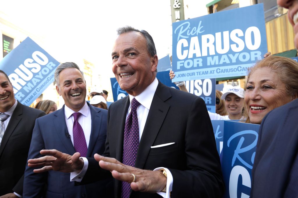 Billionaire developer Rick Caruso, center, at a campaign event at The Grove in Los Angeles on May 12, 2022. Caruso advanced to a November runoff in the mayor’s race on Tuesday. (Genaro Molina/Los Angeles Times via Getty Images)