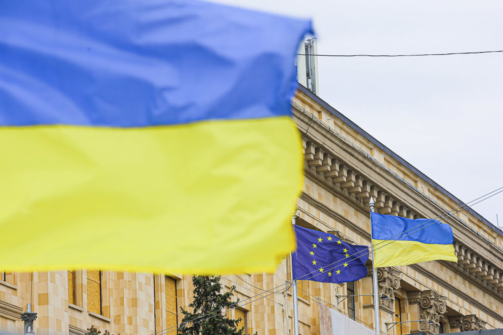Ukrainian and E.U. flags in front of the Kharkiv Regional Government headquarters in the center of Kharkiv. Russia invaded Ukraine on 24 February 2022, triggering the largest military attack in Europe since World War II. (Aziz Karimov—SOPA Images/LightRocket/Getty Images)