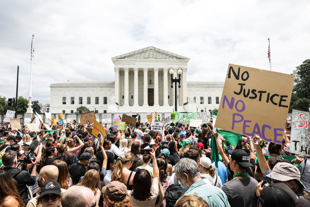 Abortion rights demonstrators outside the US Supreme Court in Washington, D.C., US, on Friday, June 24, 2022. A deeply divided Supreme Court overturned the 1973 Roe v. Wade decision and wiped out the constitutional right to abortion. (Valerie Plesch/Bloomberg via Getty Images)