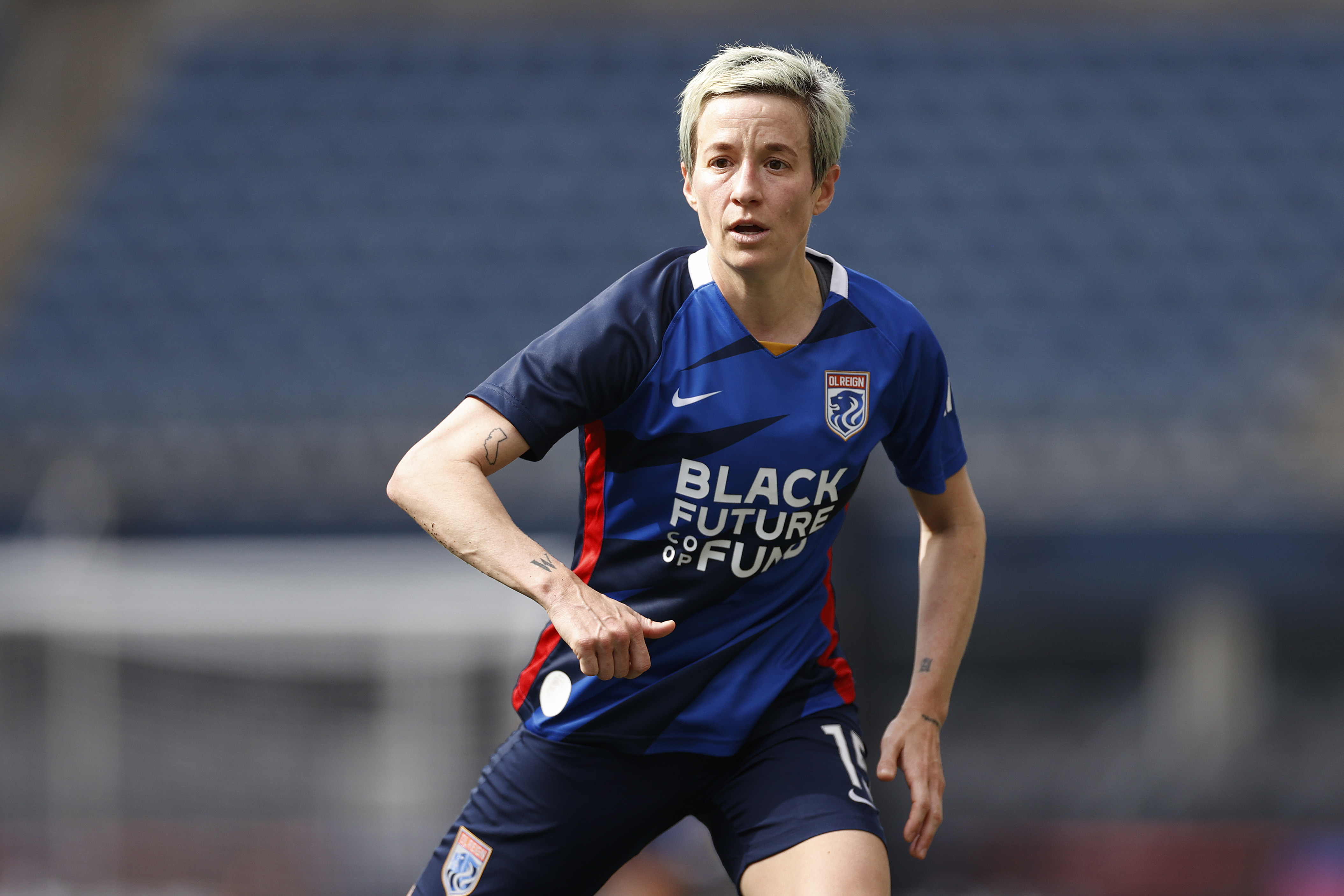 Megan Rapinoe of OL Reign looks on against the Washington Spirit during the second half at Lumen Field on May 22, 2022 in Seattle, Washington. (Steph Chambers/Getty Images)