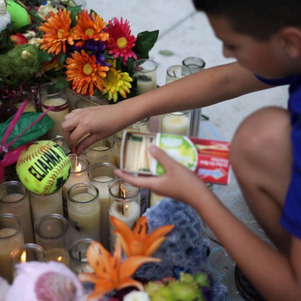 UVALDE, TEXAS - JUNE 03: Brad Fowler of San Antonio, Texas, lights up candles at a memorial dedicated to the victims of the mass shooting at Robb Elementary School on June 3, 2022 in Uvalde, Texas. 19 students and two teachers were killed on May 24 after an 18-year-old gunman opened fire inside the school.