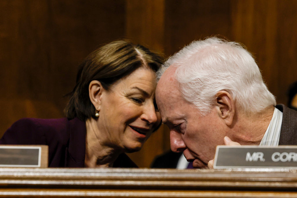 Sen. Amy Klobuchar, Democrat of Minnesota, speaks to Sen. John Cornyn, Republican of Texas, during a Senate Judiciary Committee hearing on "Protecting America’s Children From Gun Violence" at the U.S. Capitol on June 15, 2022 in Washington, DC. (Anna Moneymaker—Getty Images)