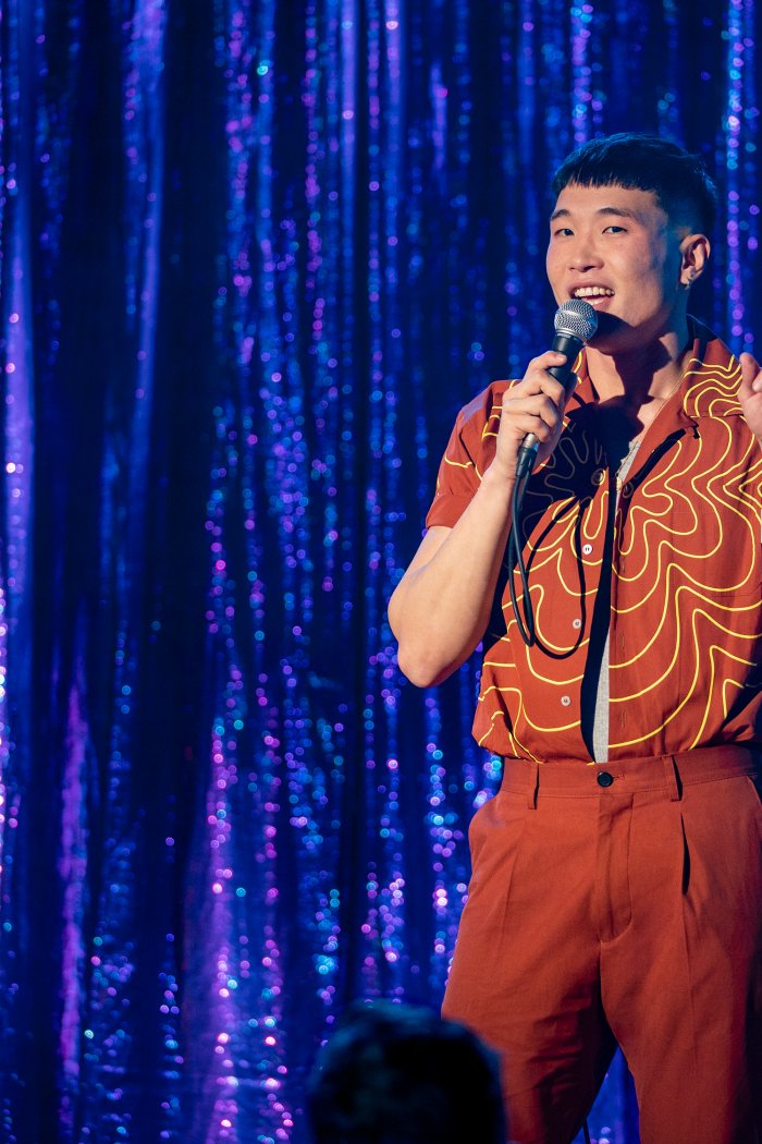 Joel Kim Booster in his Netflix stand-up special,  Psychosexual.