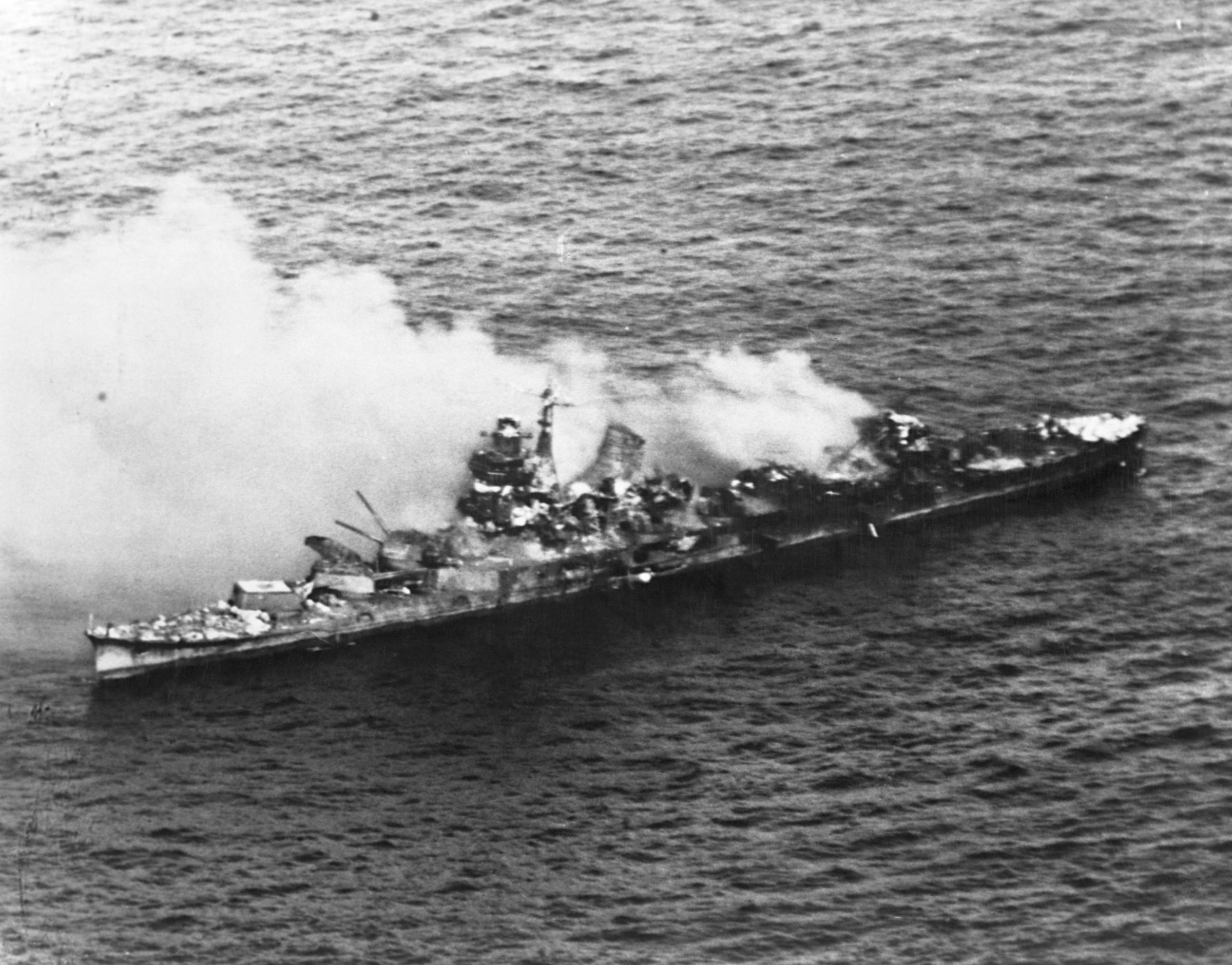 A Japanese Mogani class cruiser burns after being bombed in the Battle of Midway in June 1942.