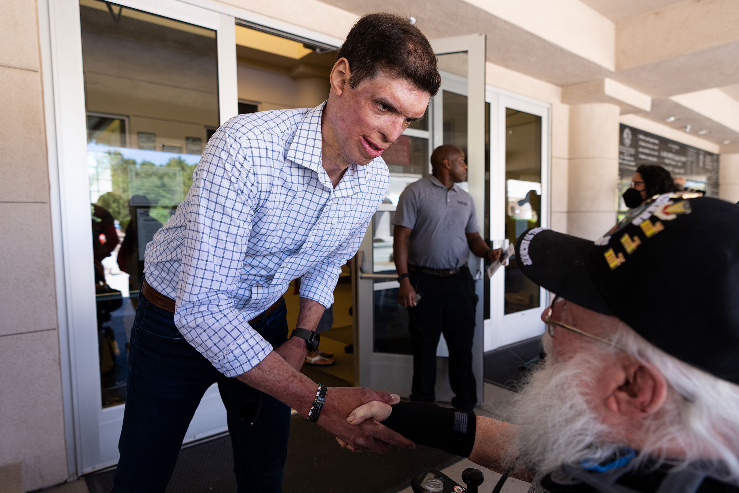 Brown shakes hands with a veteran at the Memorial Day Ceremony at the Southern Nevada Veterans Memorial Cemetery in Boulder City on May 30. (Bill Clark—CQ-Roll Call/Getty Images)