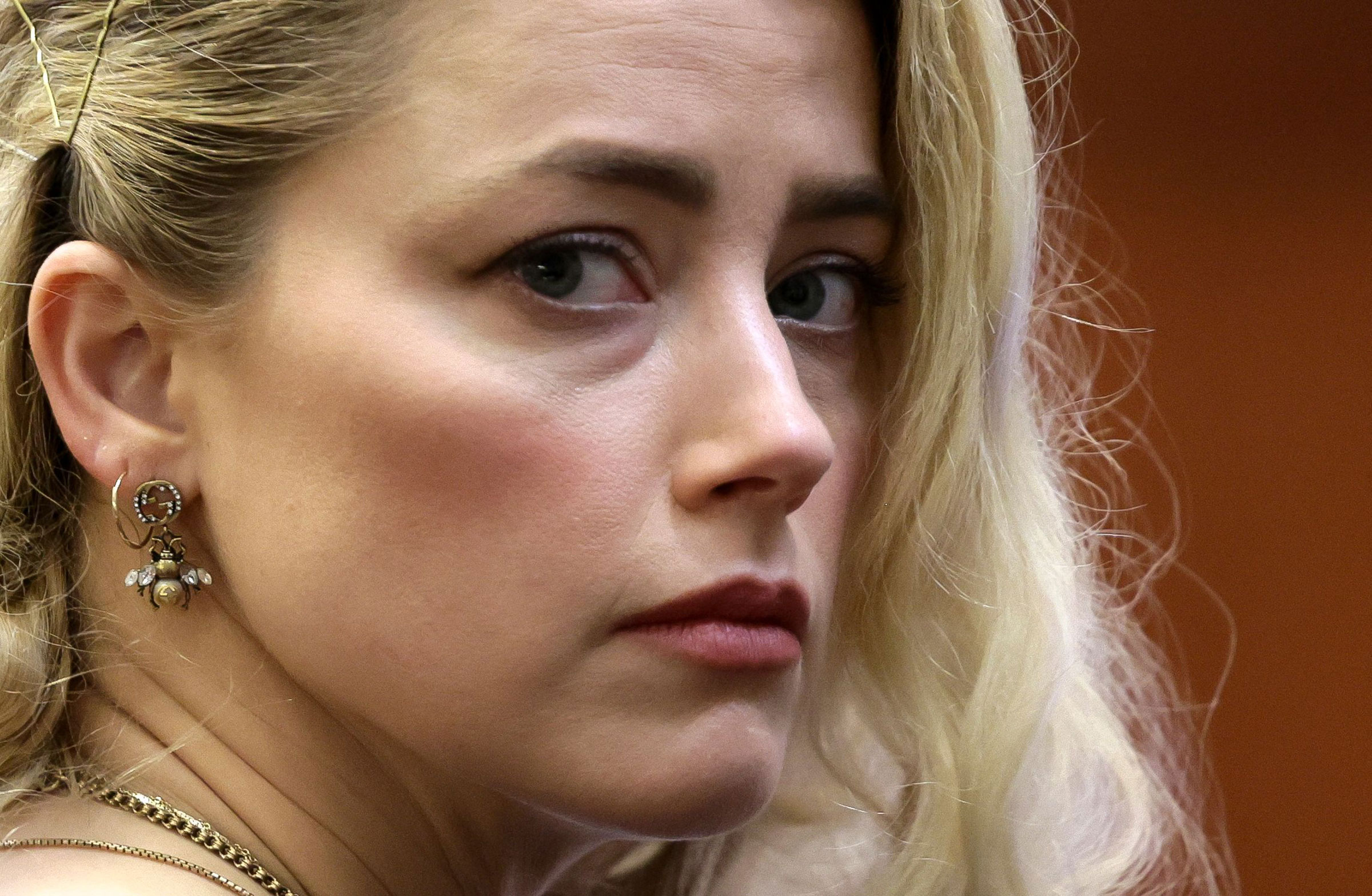 Amber Heard waits before the jury announced a split verdict in favor of both Johnny Depp and Amber Heard on their claim and counter-claim in the Depp v. Heard civil defamation trial at the Fairfax County Circuit Courthouse in Fairfax, Va., on June 1, 2022. (Evelyn Hockstein—Pool/AFP/Getty Images)