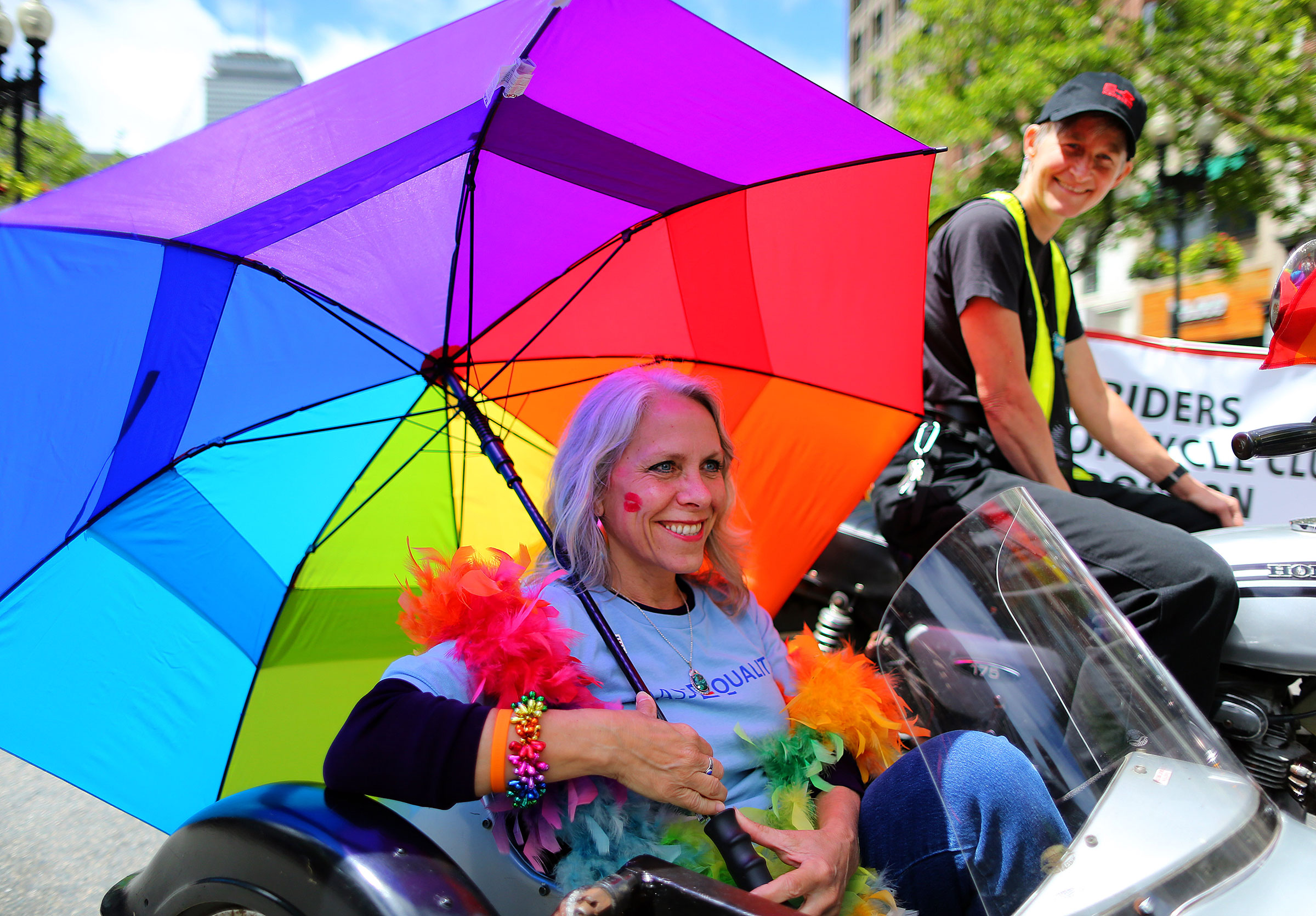 Robyn Ochs, left, gets a ride in a motorcycle sidecar from Peg Preble at the annual Boston Pride Parade on June 8, 2013. (John Tlumacki—The Boston Globe/Getty Images)