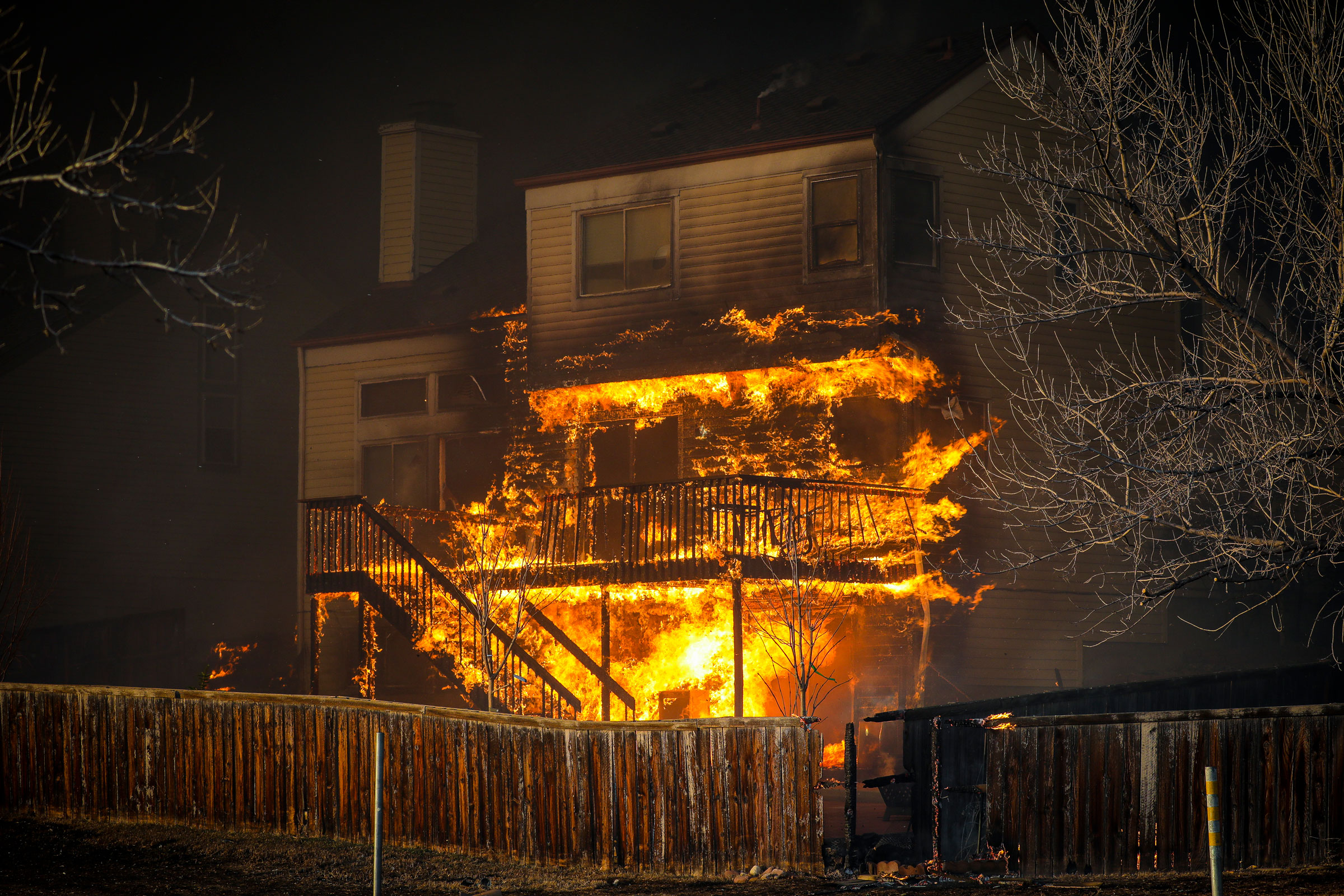 A home burns after a fast moving wildfire swept through the area in the Centennial Heights neighborhood of Louisville, Colorado, on December 30, 2021. (Marc Piscotty—Getty Images)