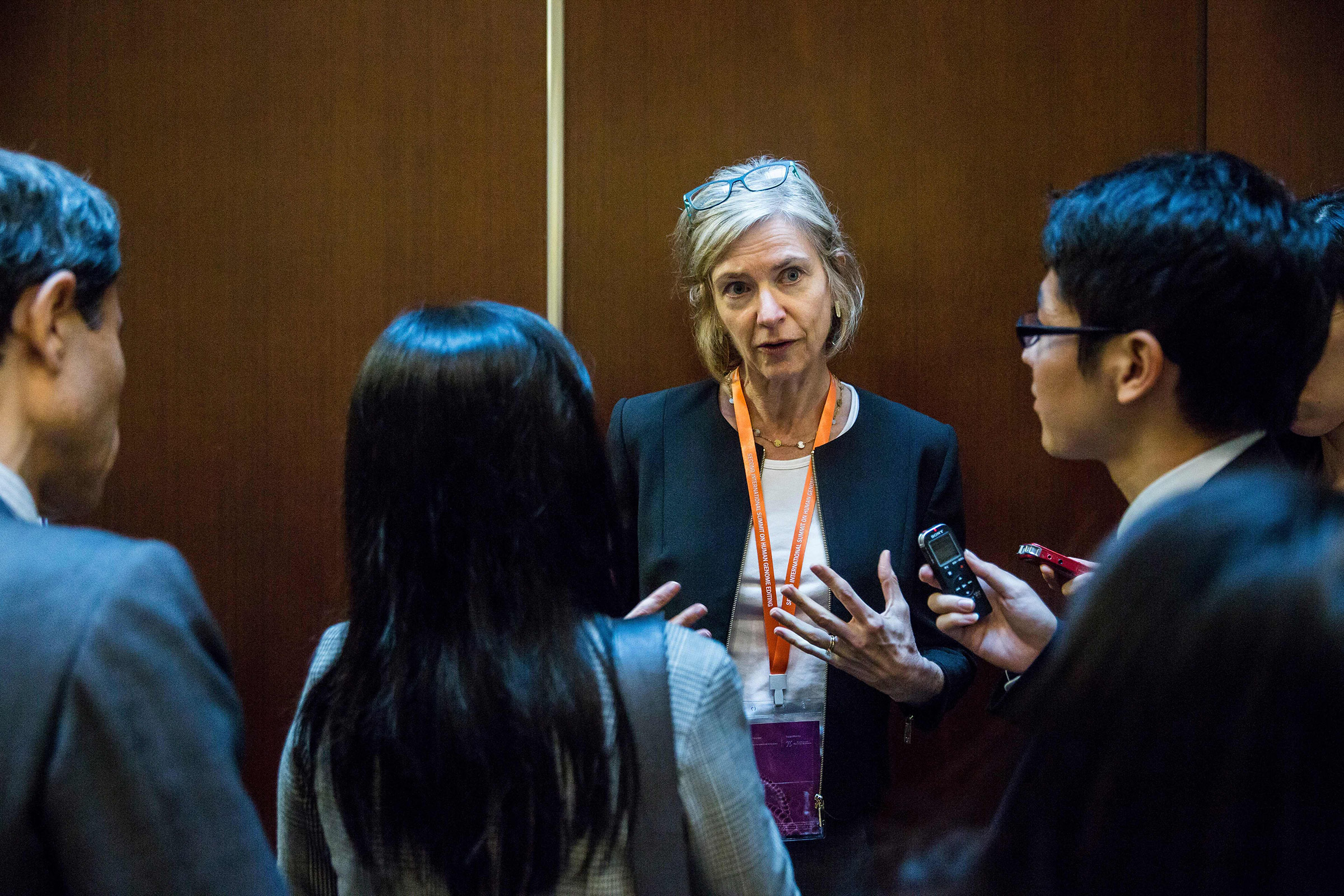 Jennifer Doudna, center, is interviewed during the Second International Summit on Human Genome Editing in Hong Kong, on Nov. 27, 2018. (Isaac Lawrence—AFP/Getty Images)