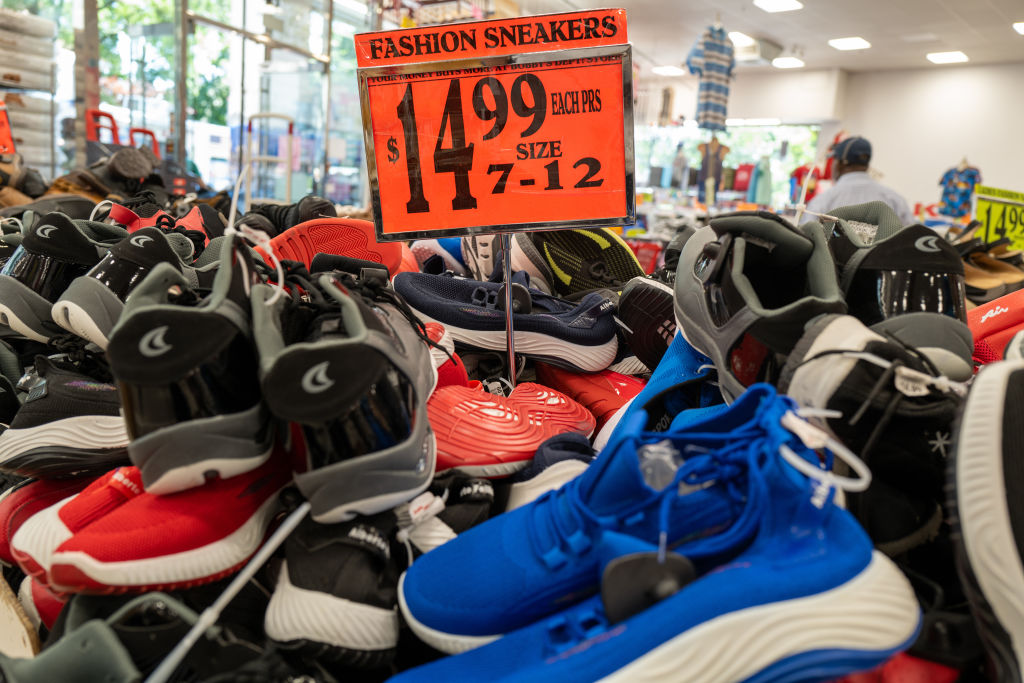 NEW YORK, NEW YORK - JUNE 15: Sneakers sit for sale at a store along a busy shopping street in the Flatbush neighborhood of Brooklyn on June 15, 2022 in New York City. (Spencer Platt/Getty Images)