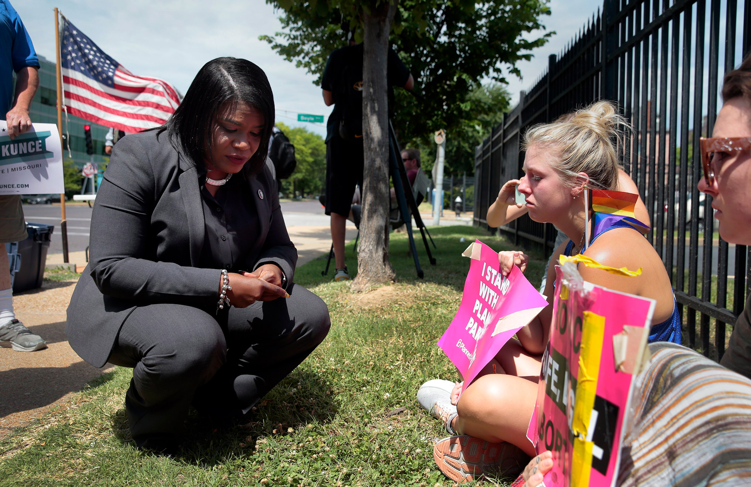 Abortion-rights advocates U.S. Rep. Cori Bush, D-St. Louis, from left, Kendyl Underwood, 20, and Brittany Nickens, 26, right, react outside Planned Parenthood of Missouri after the U.S. Supreme Court announced a decision overturning abortion protections in Roe vs Wade on June 24, 2022, in St. Louis. (Robert Cohen—St. Louis Post-Dispatch/AP)