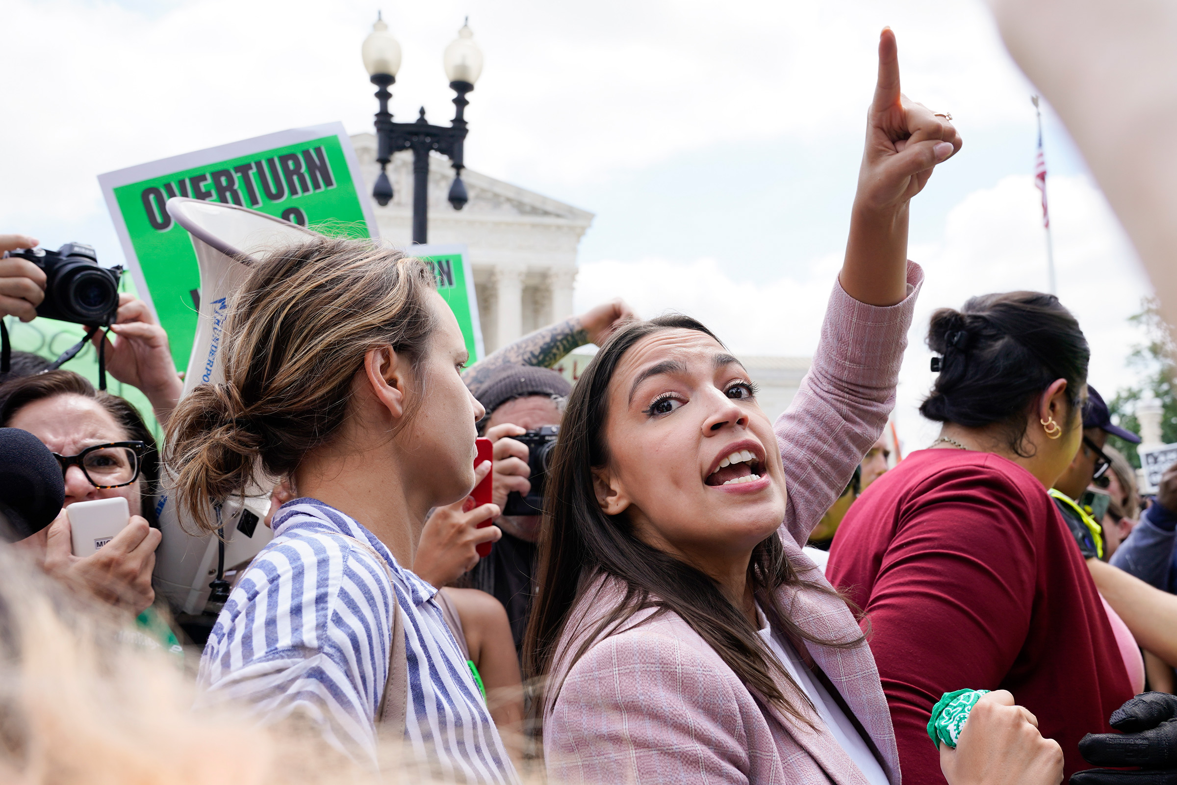 Rep. Alexandria Ocasio-Cortez, D-N.Y., joins abortion-rights activists as they demonstrate following the Supreme Court's decision to overturn Roe v. Wade in Washington, D.C., June 24, 2022. (Jacquelyn Martin—AP)