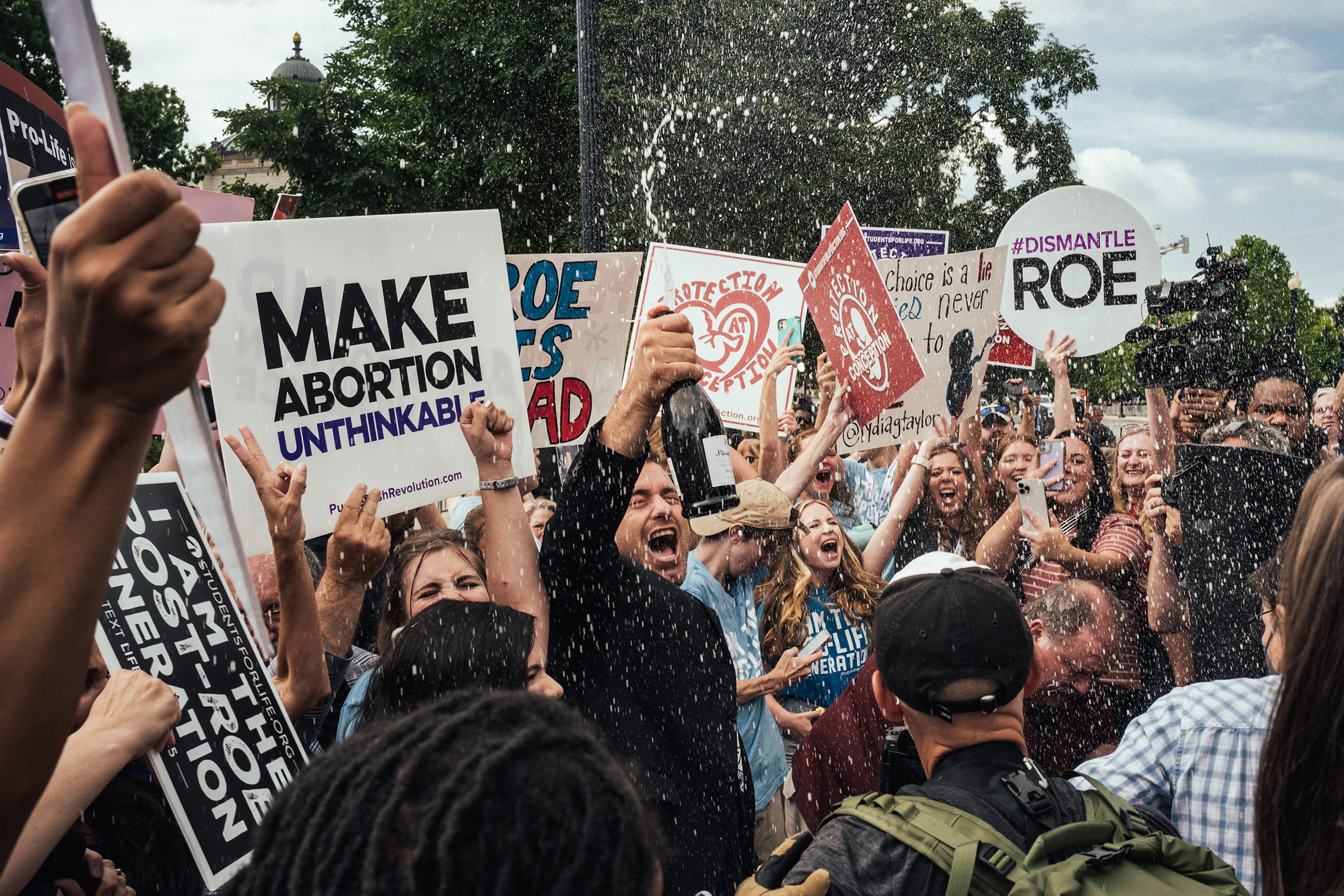 Anti-abortion demonstrators celebrate after the Supreme Cour​t decision overturning Roe v. ​Wade is announced, in Washingt​on, D.C., on June 24, 2022. (Stephen Voss—Redux)