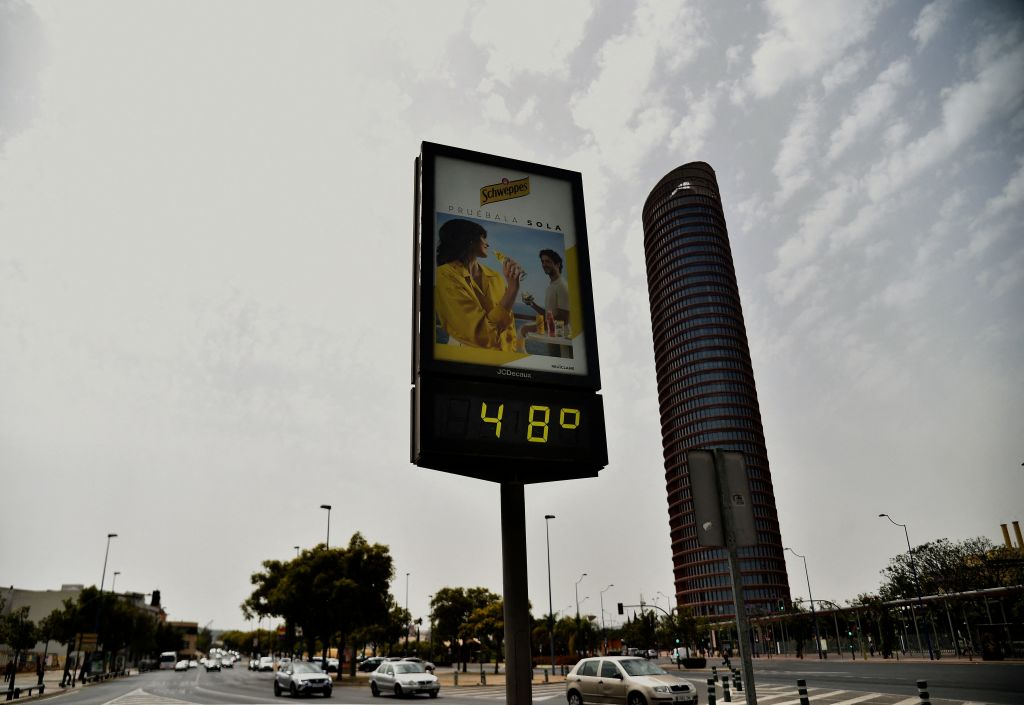 A street thermometer reads 48 degrees Celsius during a heatwave in Seville on June 13, 2022. (CRISTINA QUICLER/AFP—Getty Images)