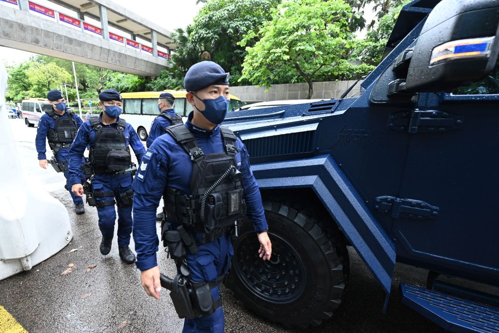 A special unit of the Hong Kong patrols the city's Wan Chai district on June 30, 2022, as Chinese President Xi Jinping arrives in Hong Kong to attend celebrations marking the 25th anniversary of the city's handover from Britain to China. (Peter Parks—AFP/Getty Images)