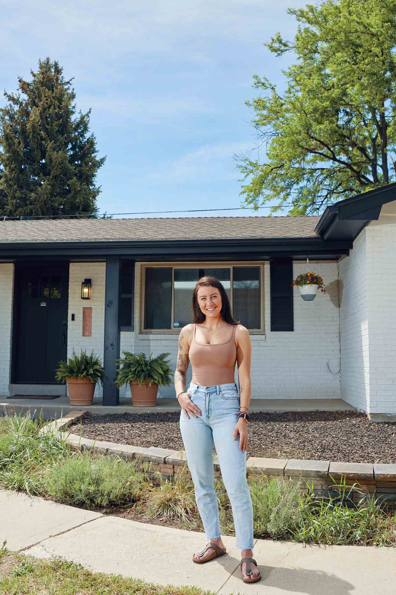 Hillary Horn photographed in front of her new home in Arvada, Colorado on 05/27/2022. Credit: Caleb Santiago Alvarado for Time Magazine.