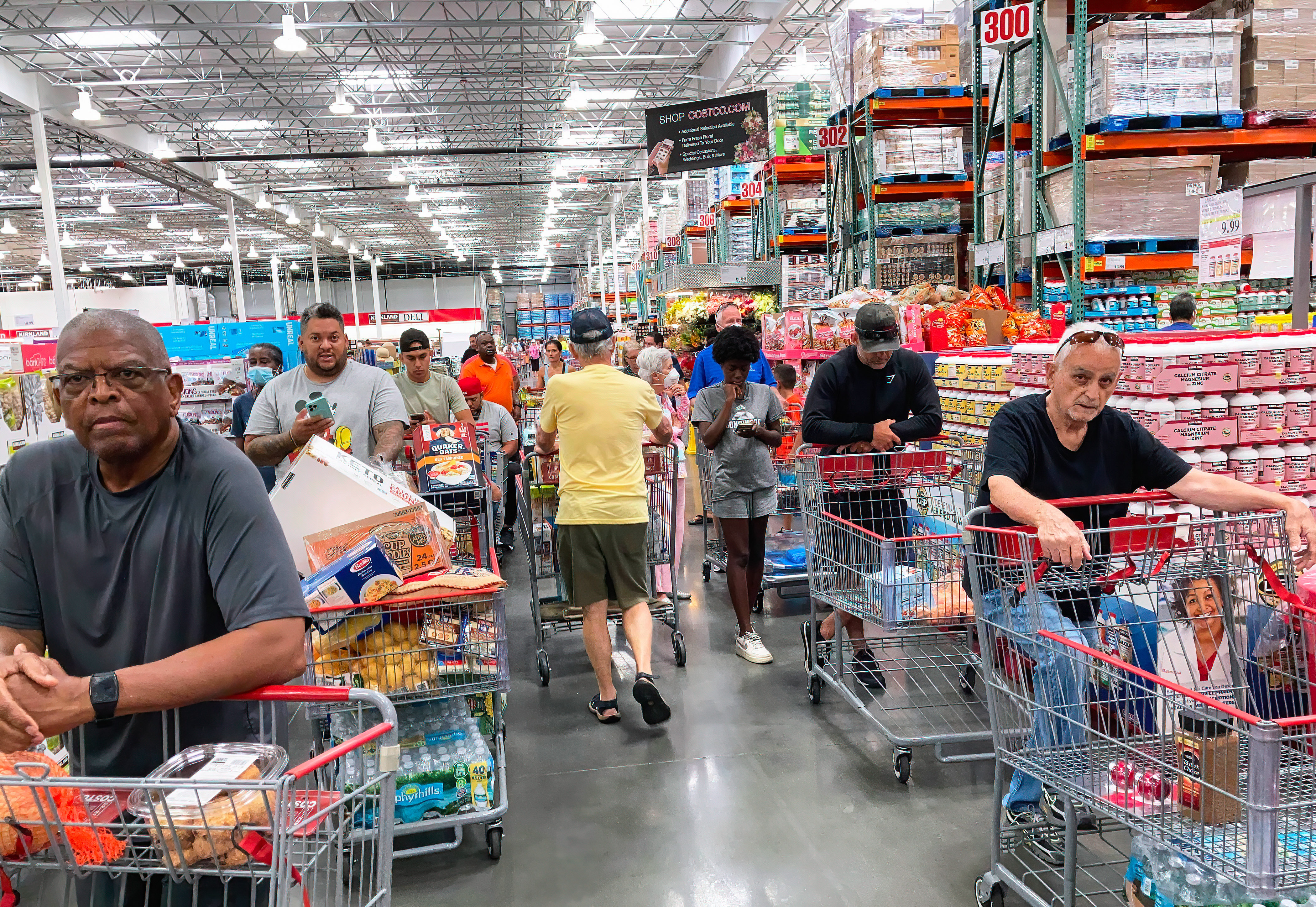 ORLANDO, FLORIDA, UNITED STATES - 2022/05/31: Shoppers wait in a check-out line at a Costco wholesale store in Orlando. (Paul Hennessy—SOPA Images/LightRocket via Getty Images)