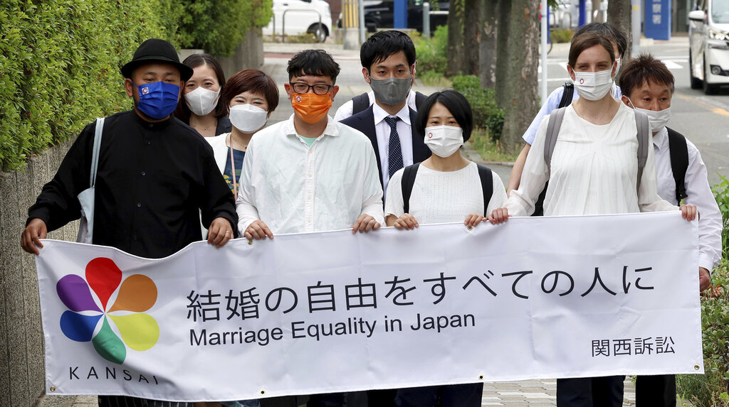 Plaintiffs march to the Osaka District Court before a judgment on same-sex marriage in Osaka City, Osaka Prefecture on June 20, 2022. (The Yomiuri Shimbun/AP Images)