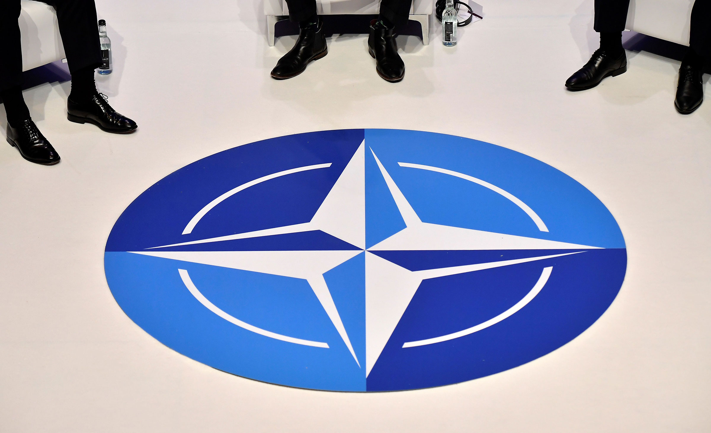 The NATO logo is pictured during a panel discussion prior to the NATO alliance summit in London, Dec. 3, 2019. (Tobias Schwarz—AFP/Getty Images)