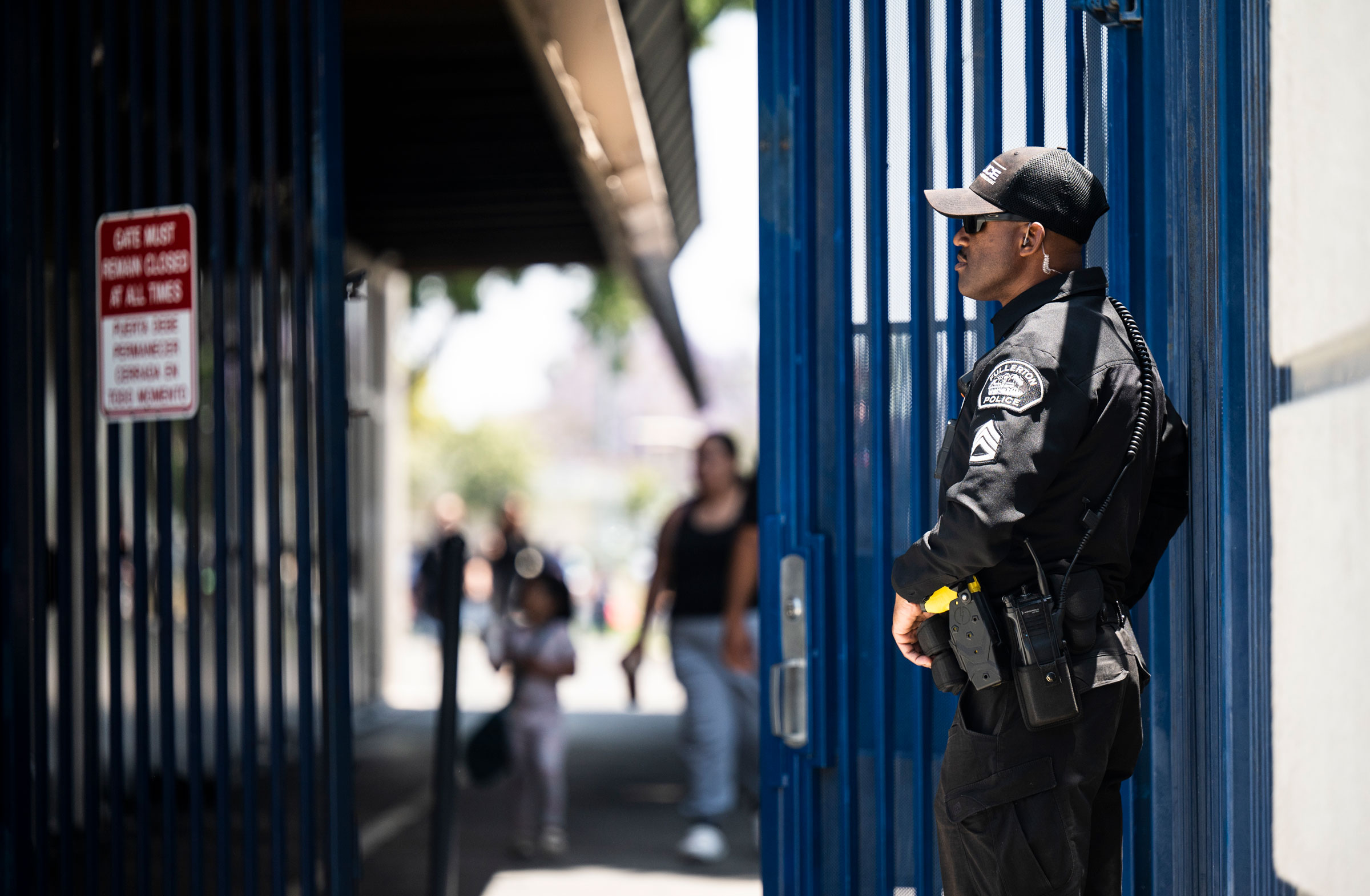A Fullerton Police Department sergeant stands near the entrance to Richman Elementary School in Fullerton, Calif., on May 25, 2022. (Paul Bersebach—MediaNews Group/Orange County Register/Getty Images)