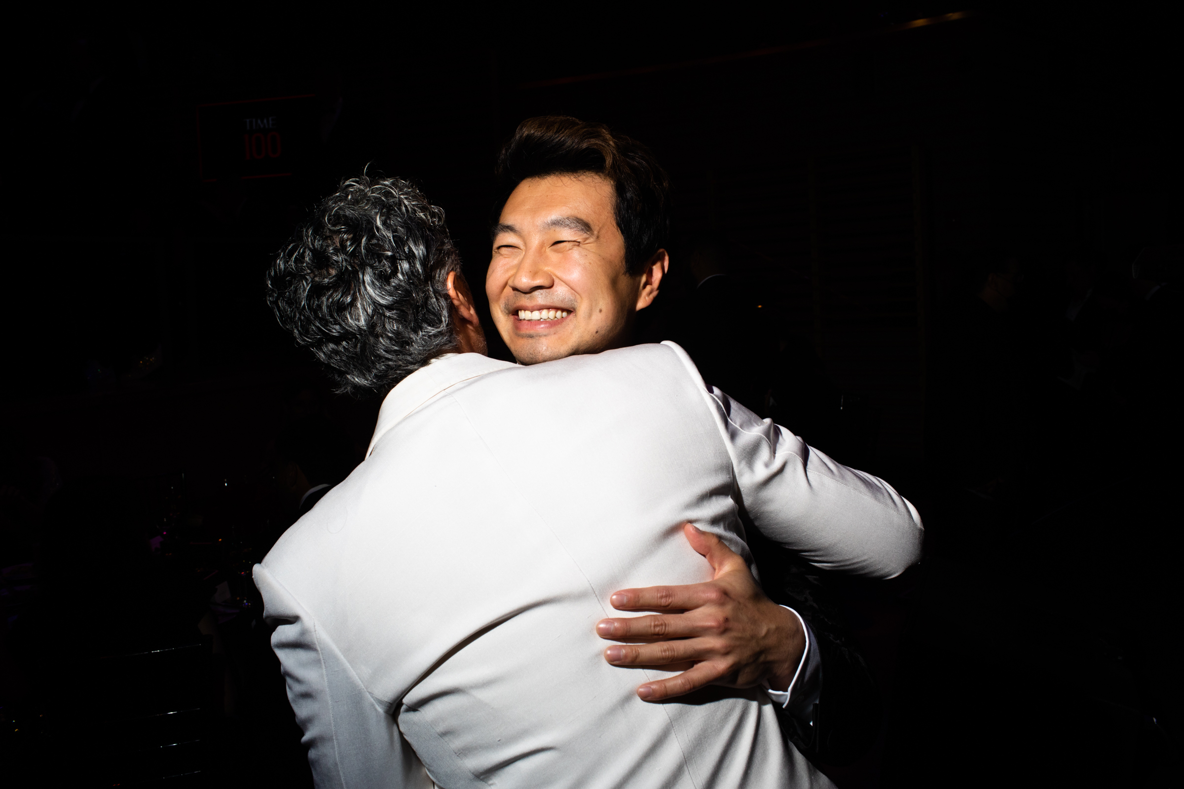 Taika Waititi and Simu Liu embrace at the TIME 100 Gala at Jazz at Lincoln Center in New York City, on June 8, 2022. (Landon Nordeman for TIME)
