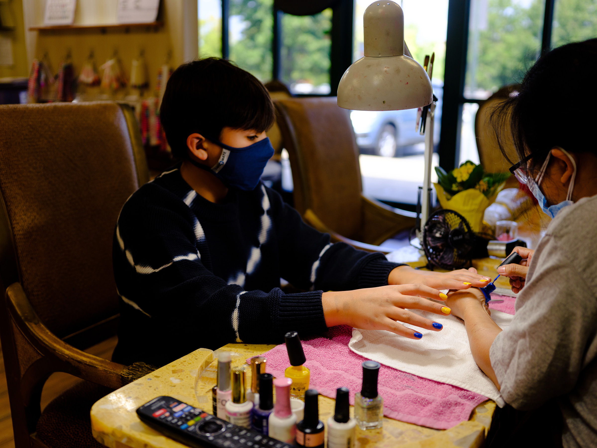 Eli, 12, gets their nails done in Mooresville, N.C. (Annie Flanagan)