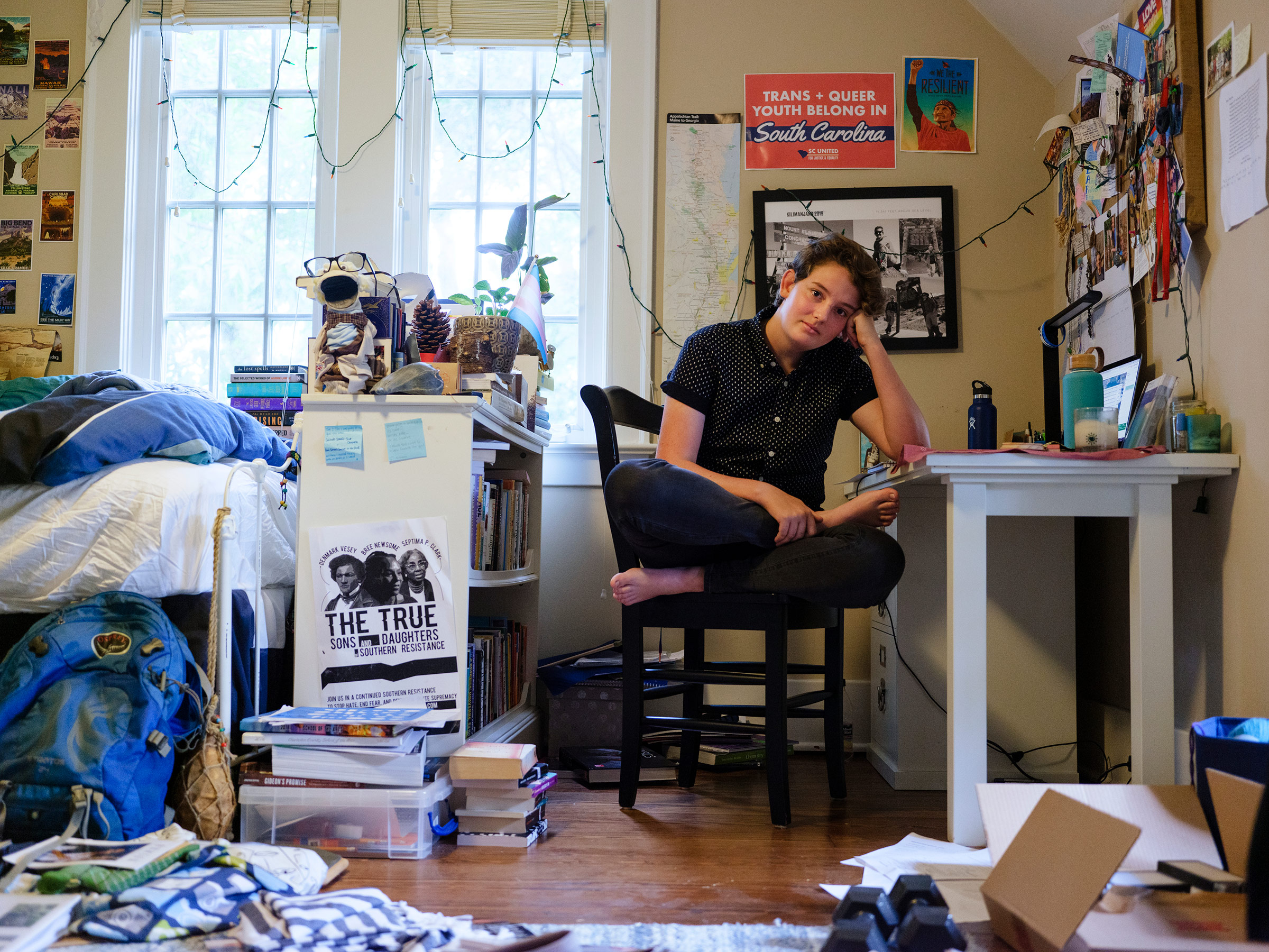 Eli, 18, sits in their room in Charleston, S.C., shortly after appearing on a panel on how to best treat and interact with trans youth at the Medical University of South Carolina. They were the only trans young person on the panel. (Annie Flanagan)