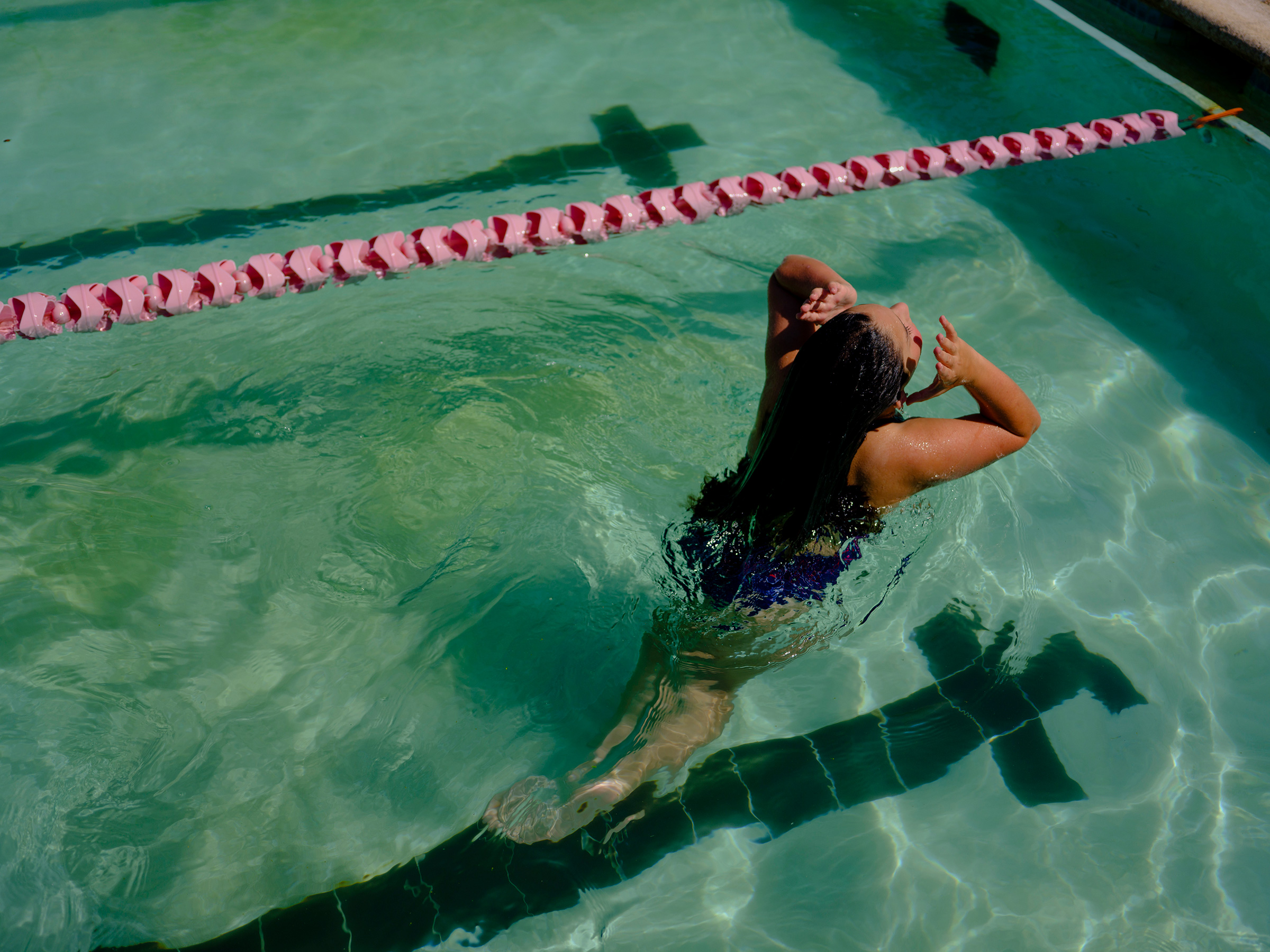 Maya, 11, swims in Houston. State law prohibits Maya from playing girls’ sports in school, but she swims on a private team. It’s not the first time being trans has prevented her from competing—she quit gymnastics years ago because she didn’t want to risk disqualifying her teammates. The experience made her “mad and sad,” she says. But she finds swimming on her new team “really fun and relaxing.” (Annie Flanagan for TIME)