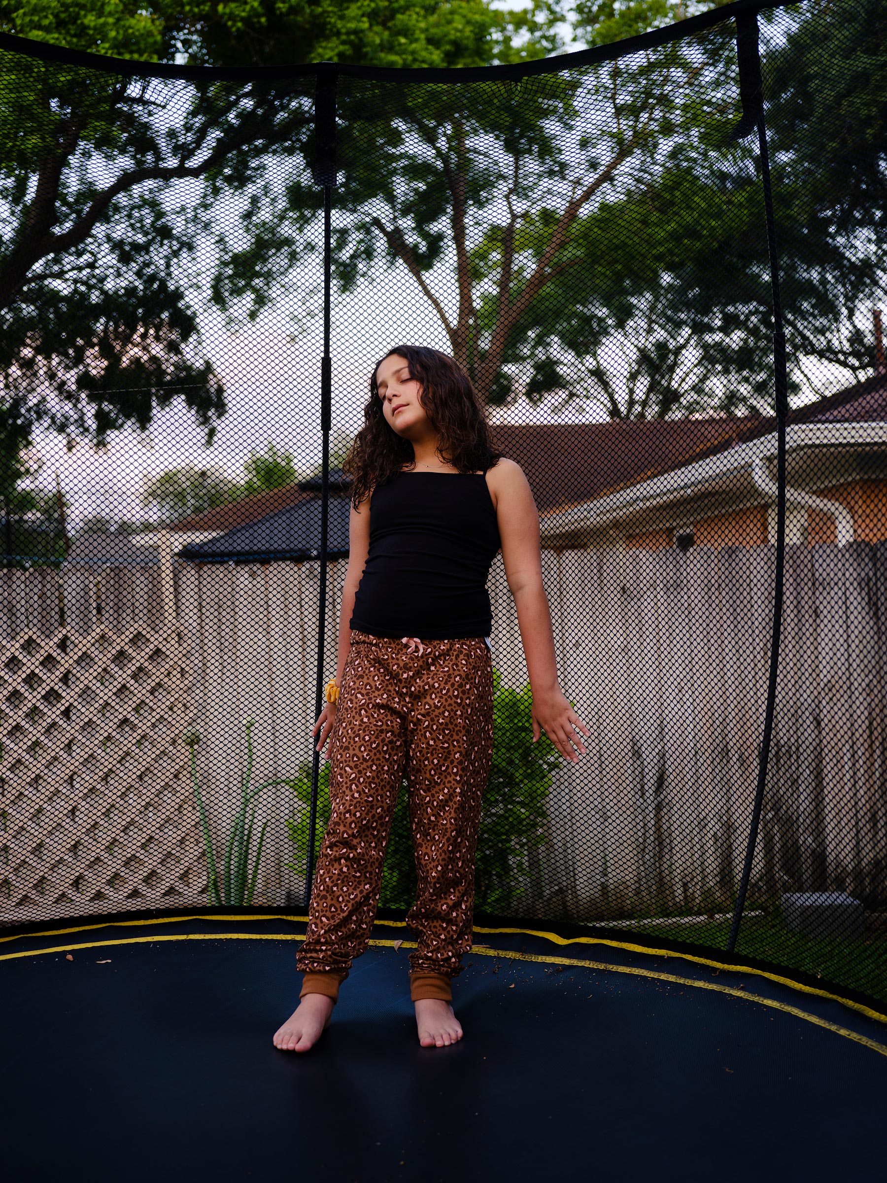 Maya, 11, outside her home in Houston.