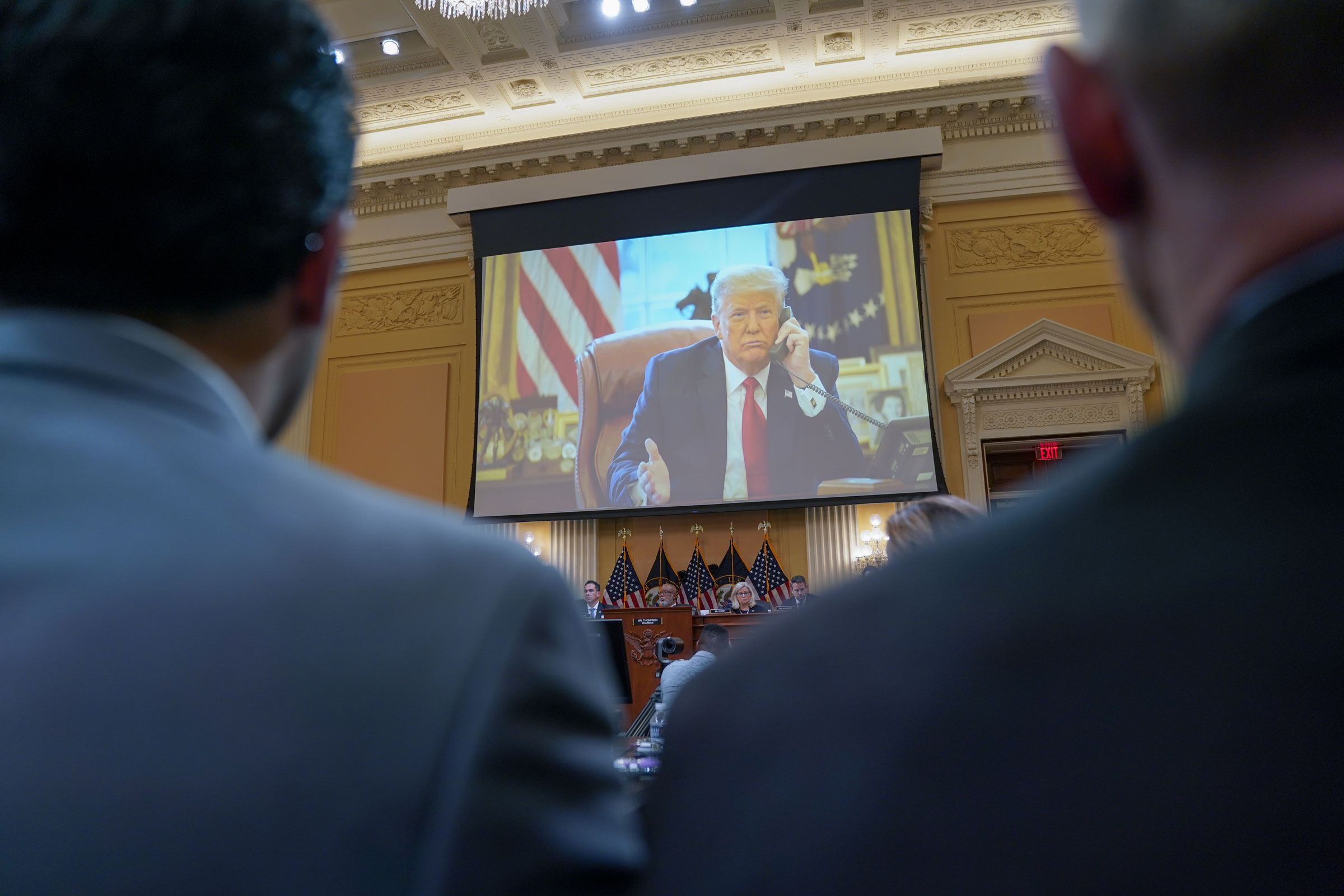 Photos of then-President Trump are shown during a House Select Committee to Investigate the January 6th hearing in the Cannon House Office Building in Washington, D.C. on Thursday, June 16, 2022. (Kent Nishimura—Los Angeles Times/Getty Images)