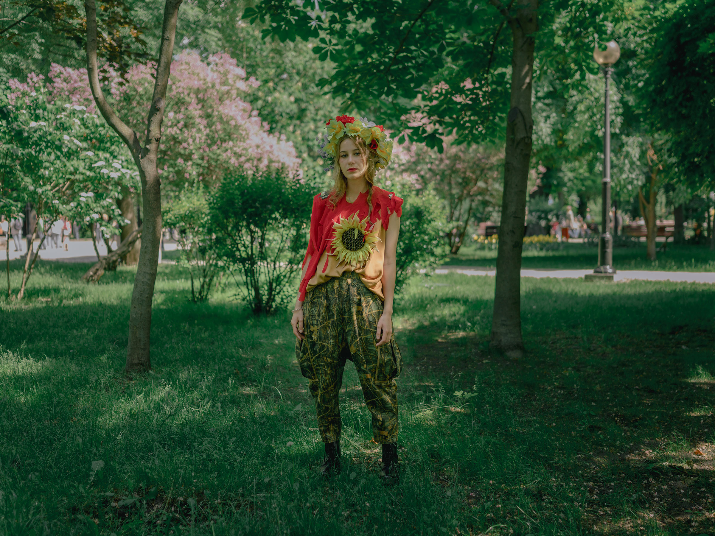 Ksenia poses for a portrait in Shevchenko Park. She is grateful that she can still live in Kyiv. (Fabian Ritter—DOCKS Collective)
