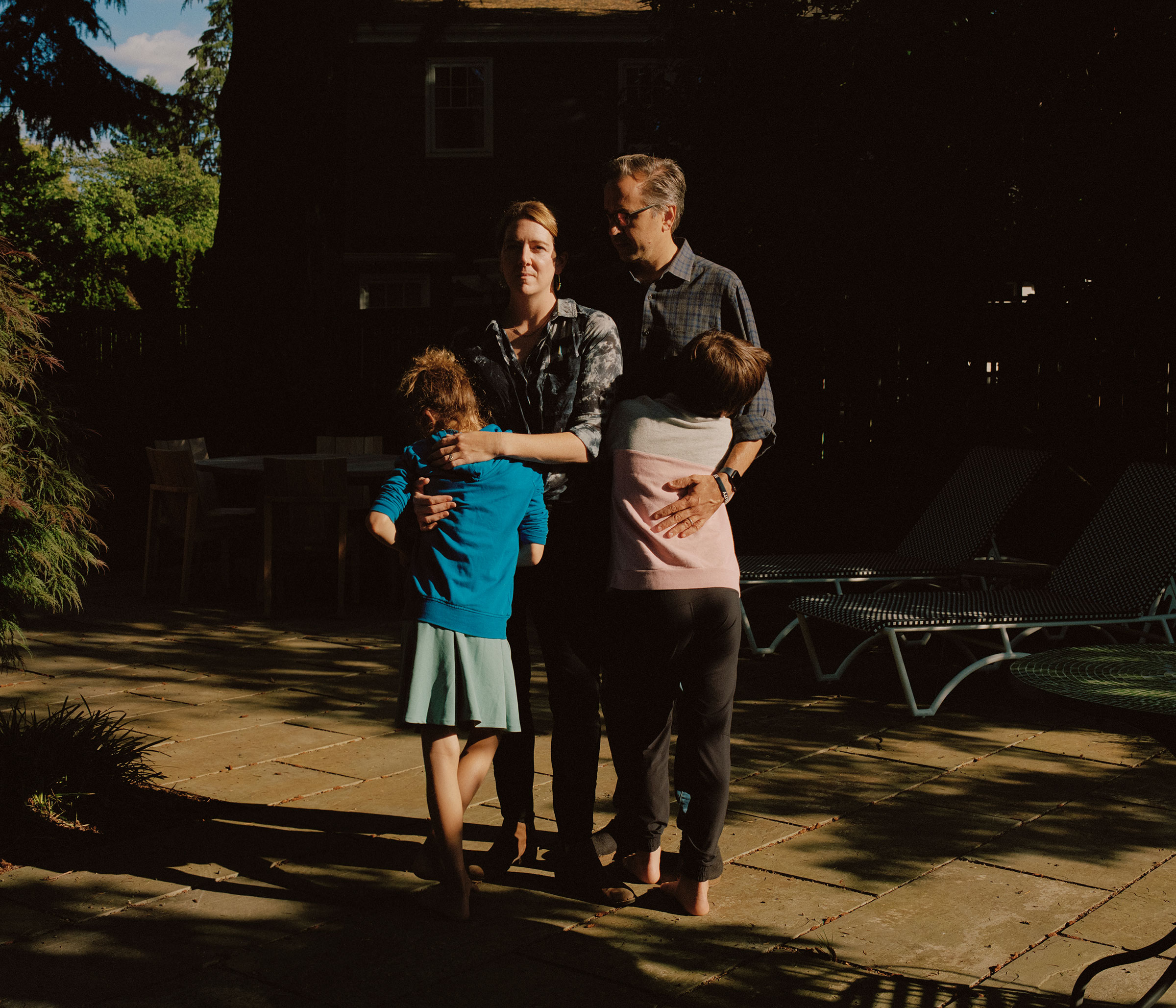 Karen and Chris with their kids at their new home in Portland, Ore. after leaving their home in Austin, Texas because of anti-trans state action. (Ricardo Nagaoka for TIME)