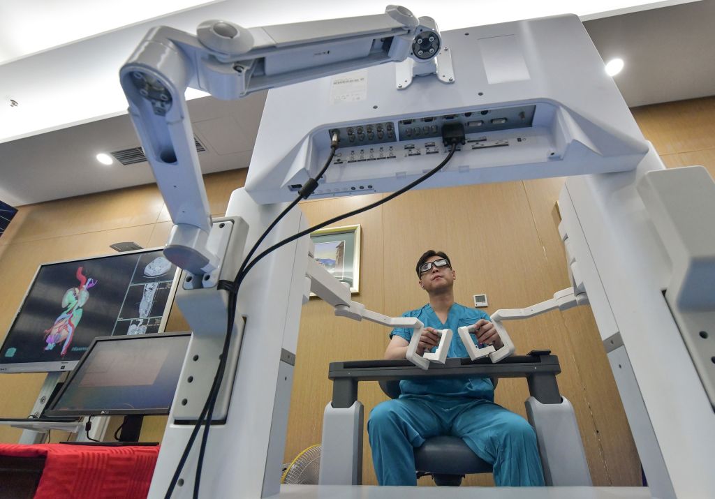 BEIJING, Sept. 24, 2020 -- Professor Niu Haitao with the Affiliated Hospital of Qingdao University performs a remote radical cystectomy on a patient 3,000 kilometers away with the help of a domestically-developed surgical robot using 5G. (Xinhua News Agency—Getty Images)